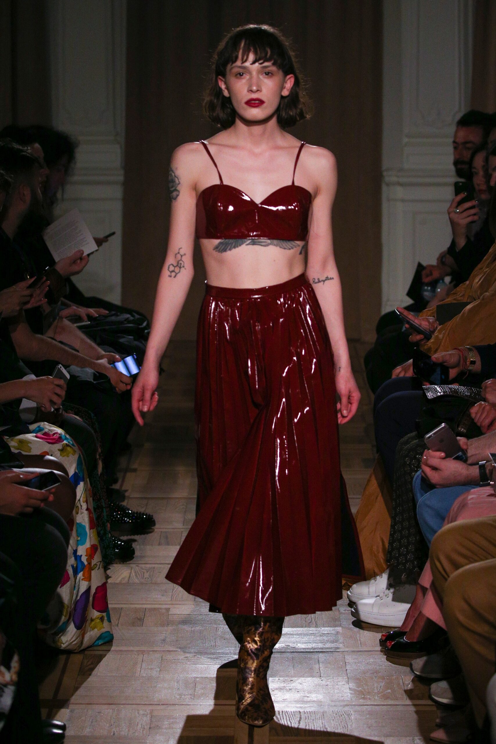 red vinyl crop-top and midi skirt