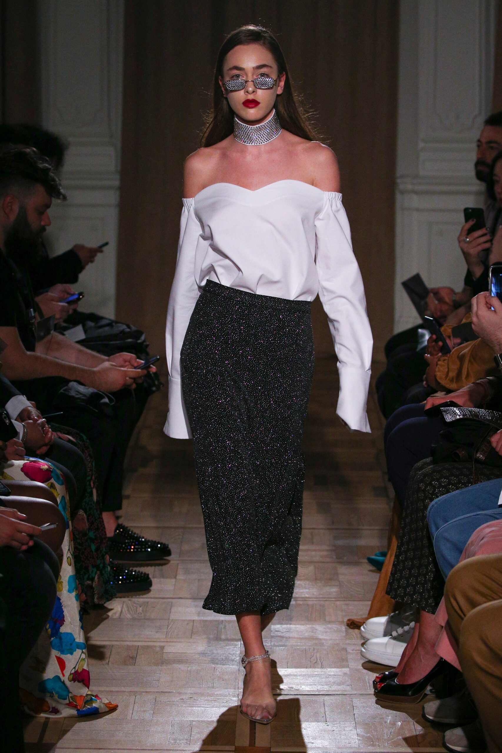 white off-shoulder blouse and black midi skirt