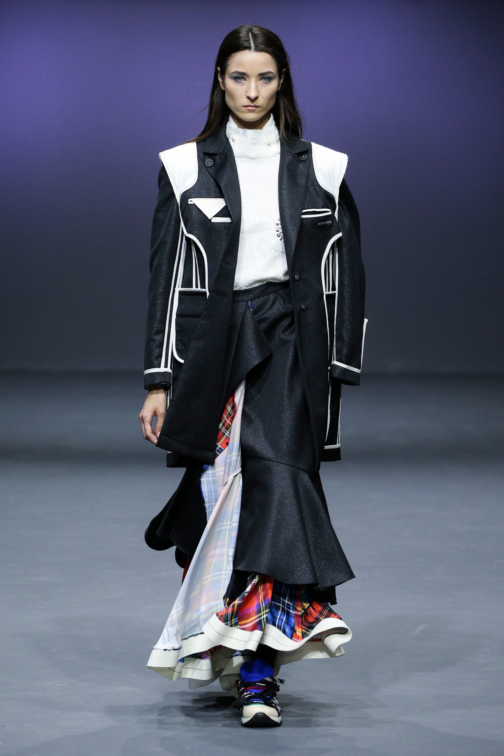 black coat multi skirt white sweater
