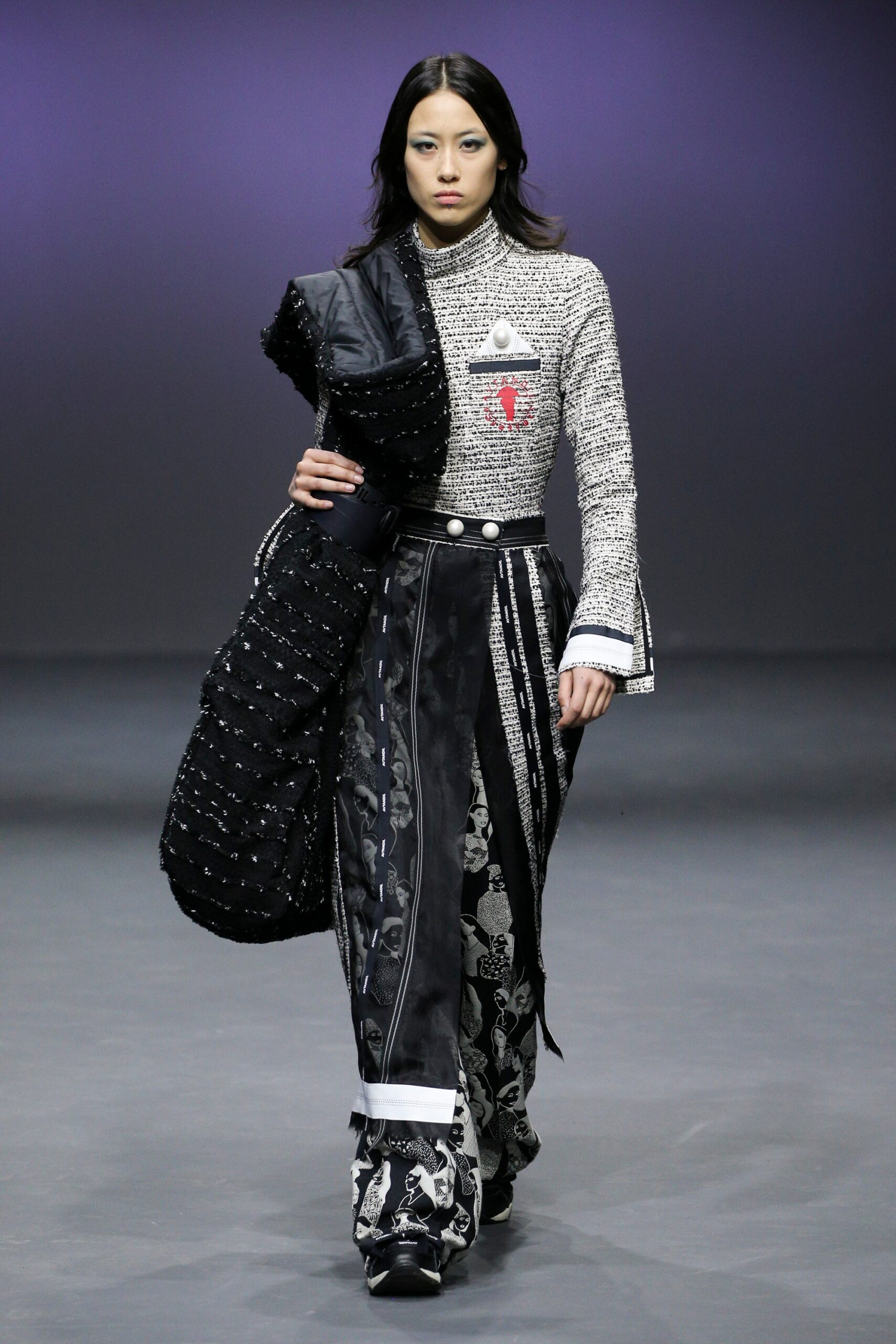 black and white embroidered top with flared pants