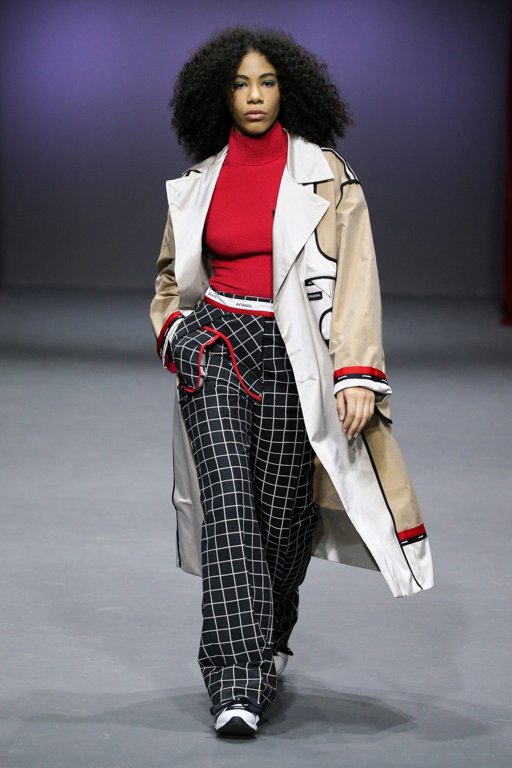 beige coat with red top