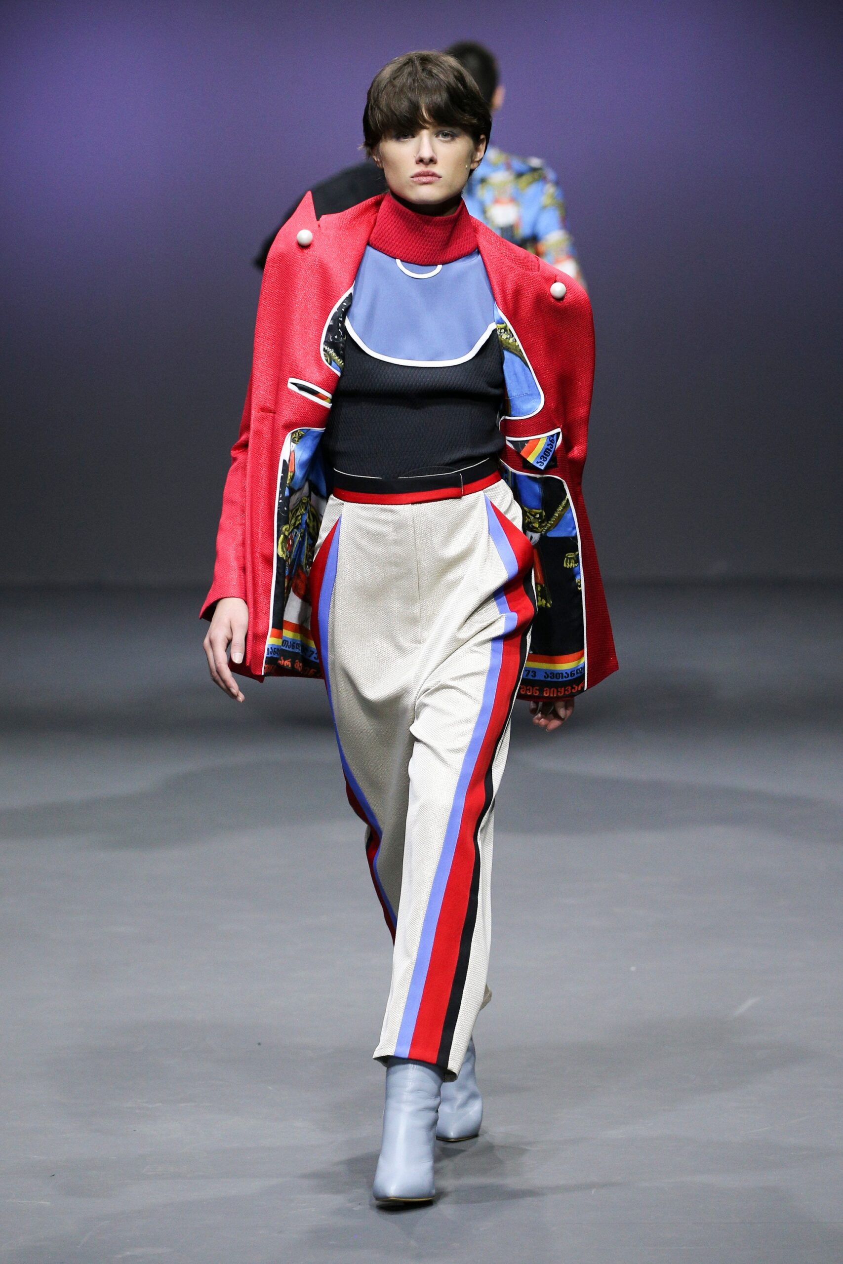 red structured jacket with black top