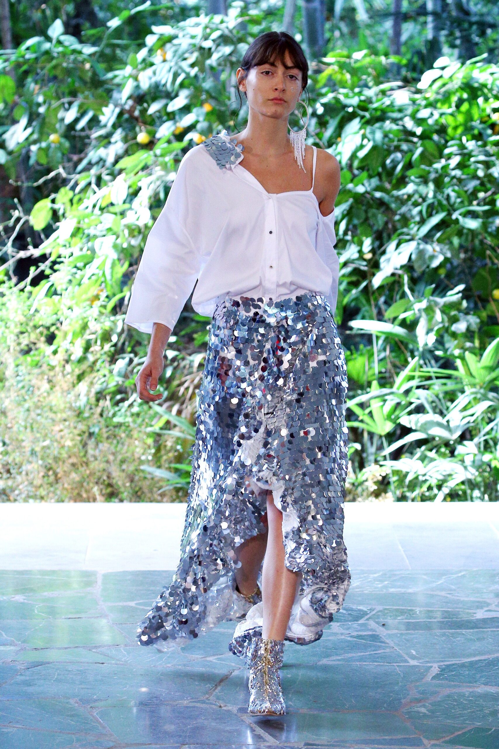 white off-shoulder blouse with silver sequin skirt