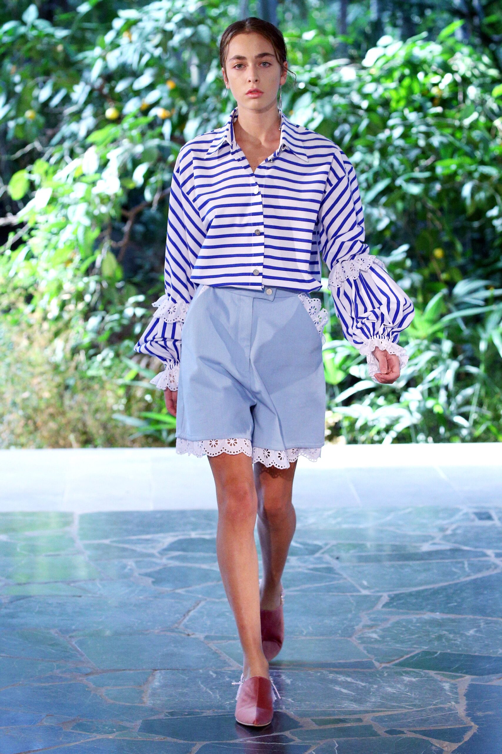 striped shirt and gray shorts