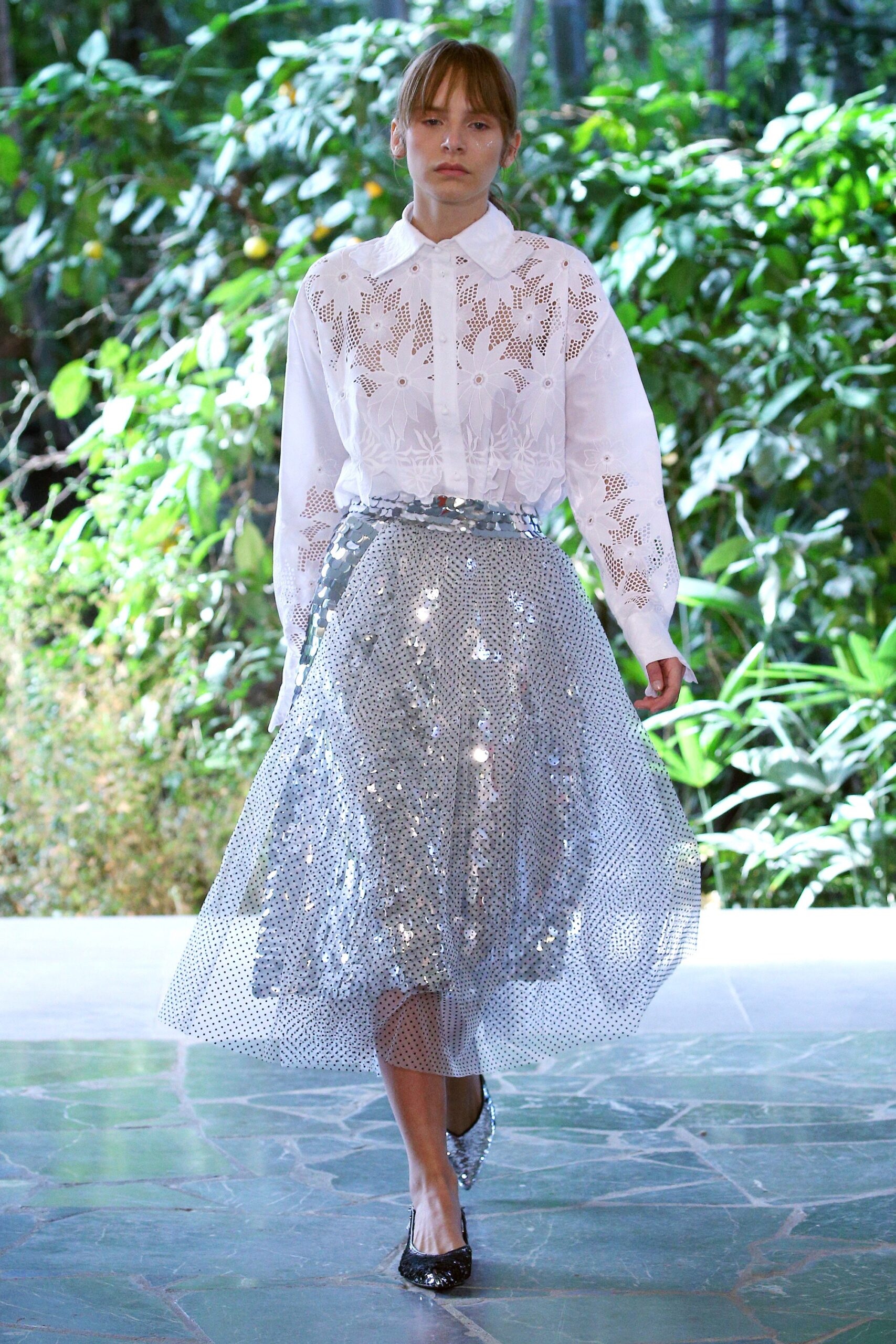 white embroidered shirt and silver skirt