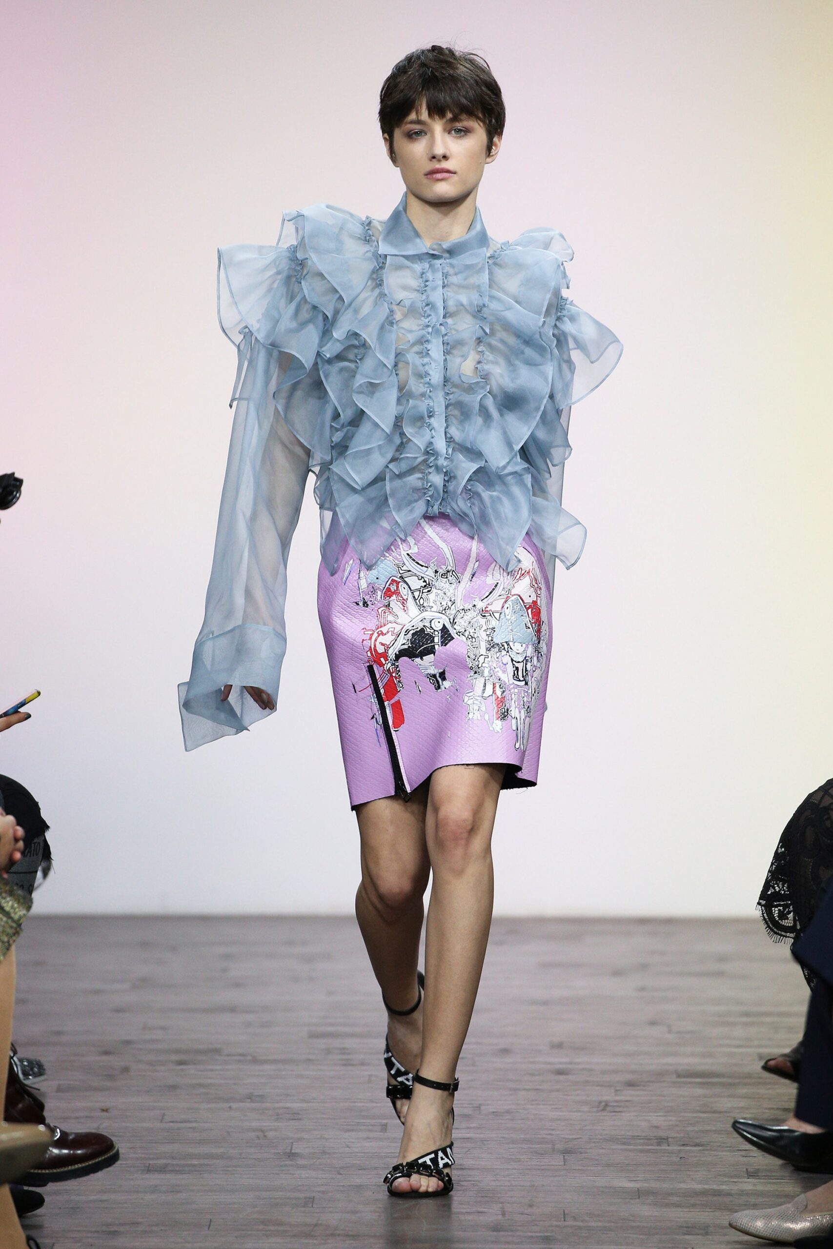 blue ruffled blouse and purple skirt