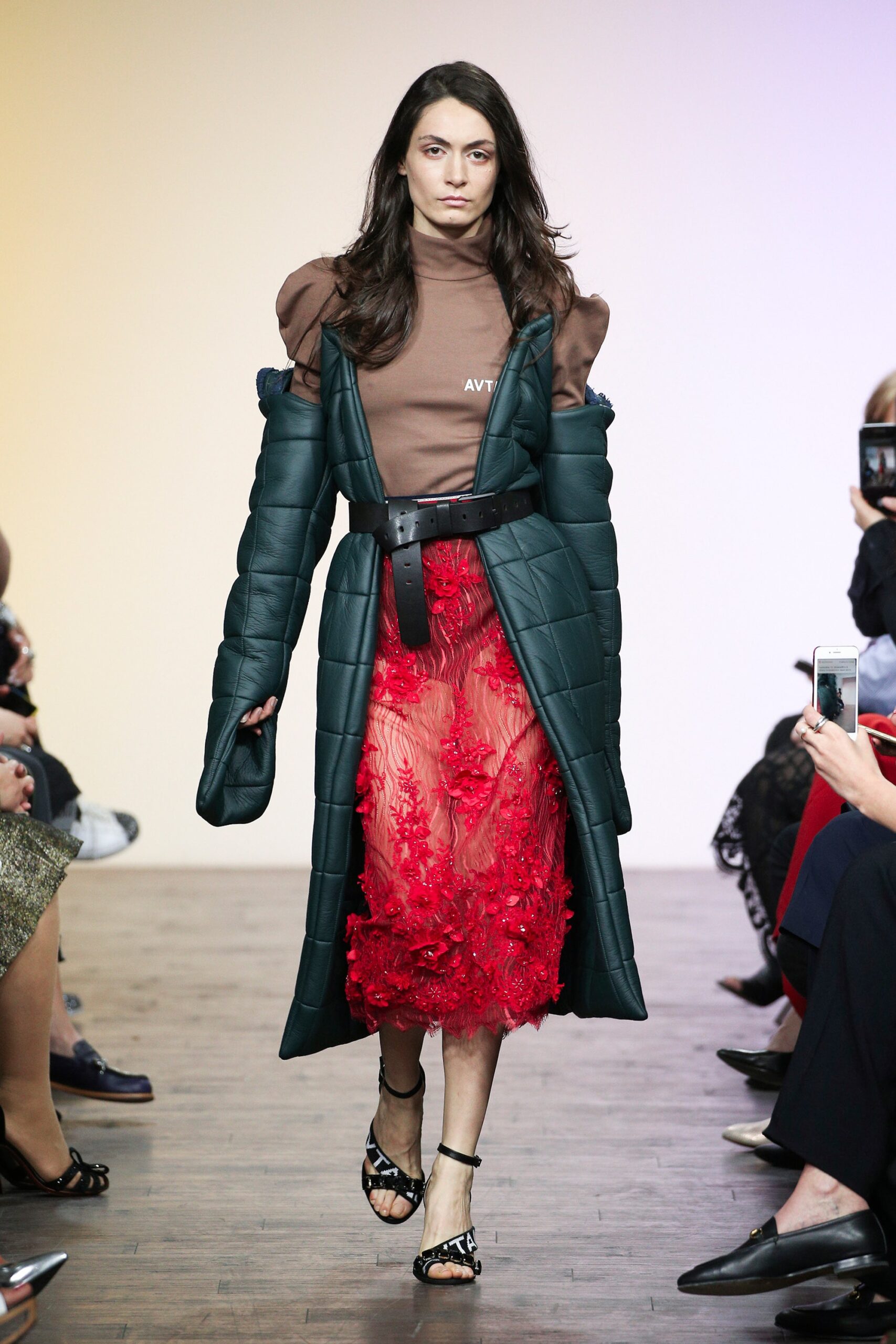 green padded coat with red lace skirt
