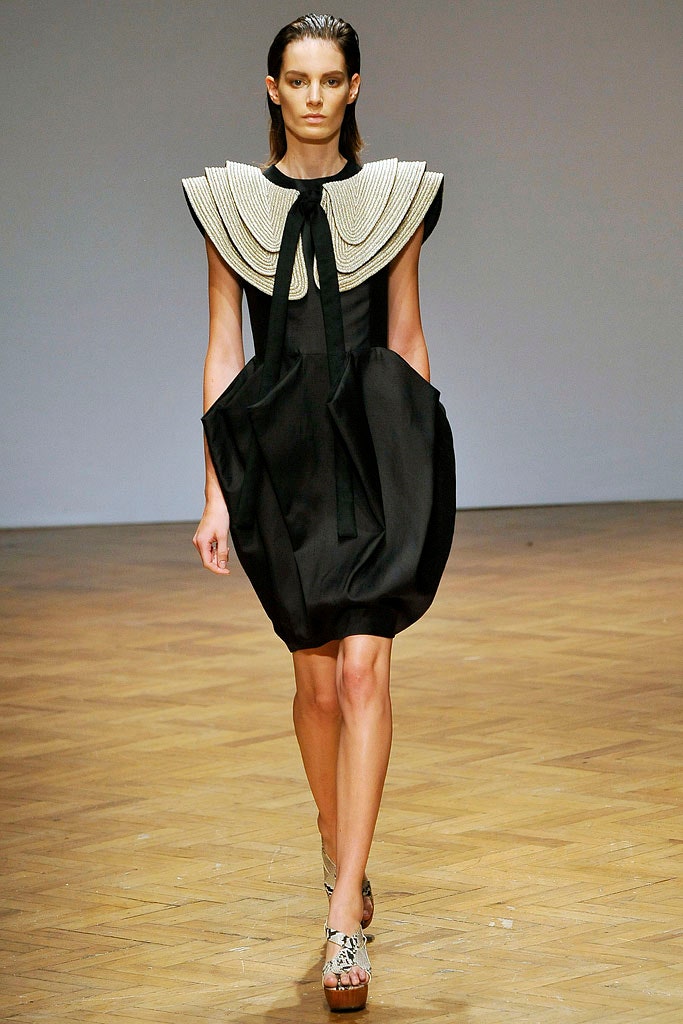 black pleated sleeveless dress