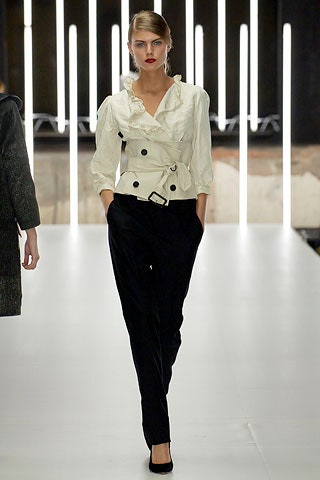 white ruffled blouse with black pants