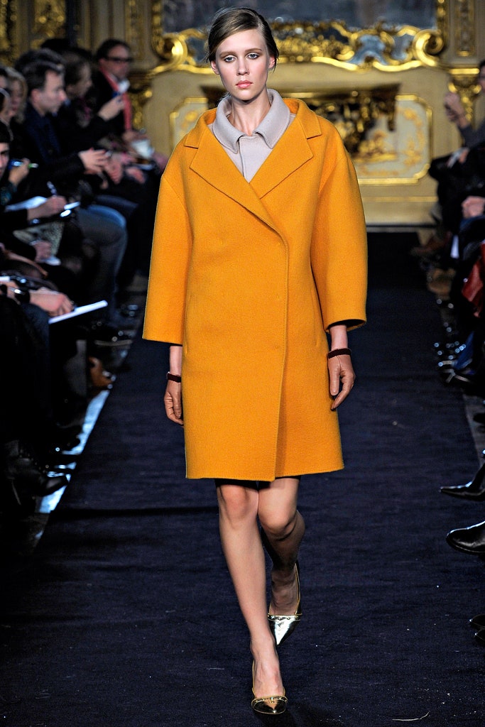 orange wool coat with beige blouse