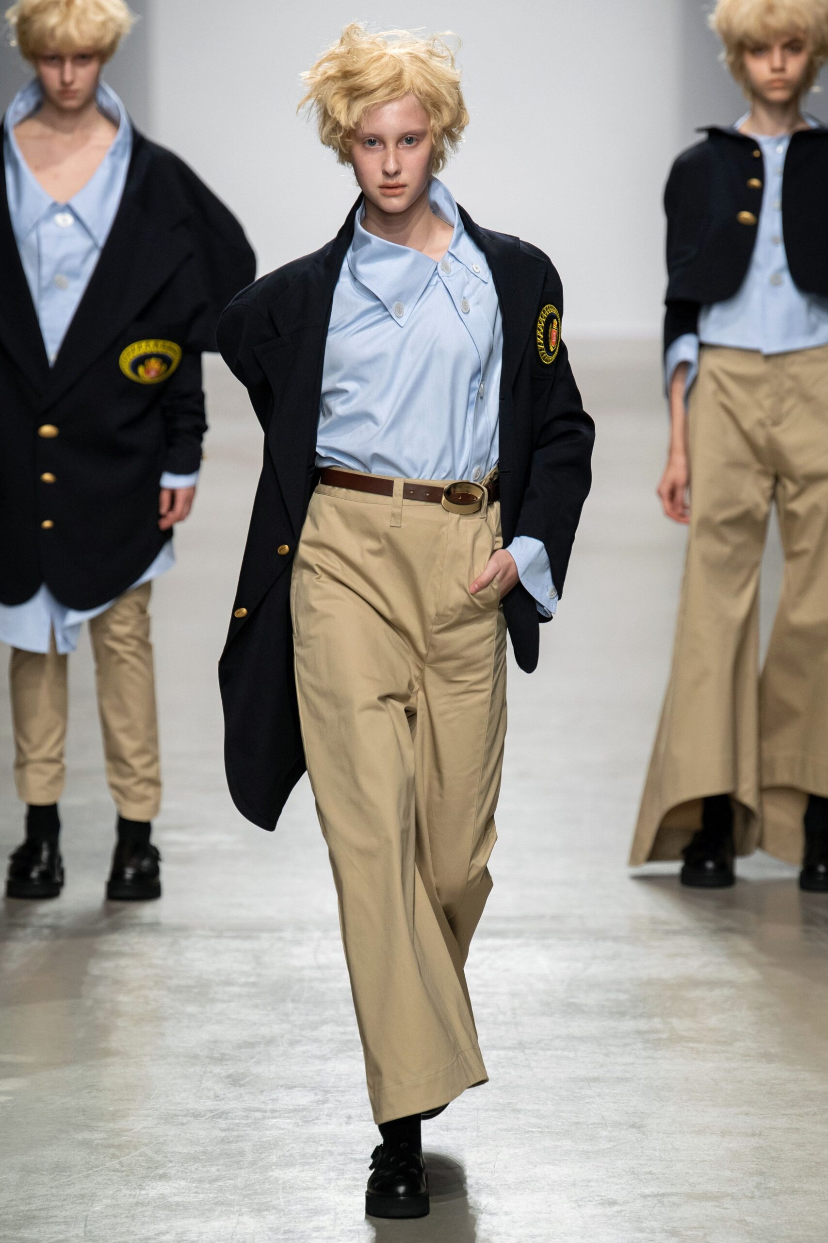 black blazer blue shirt beige pants