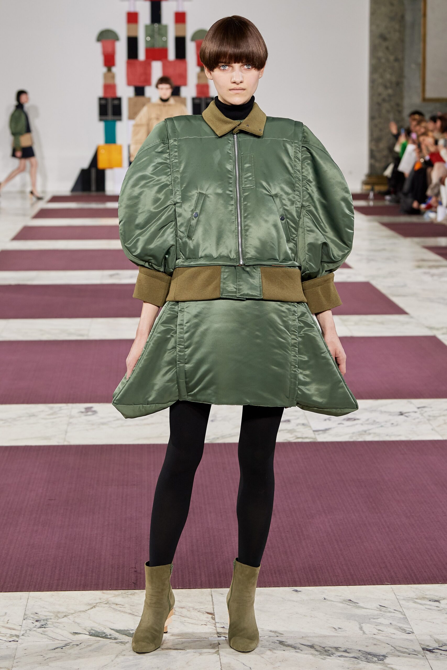 green pleated mini dress with boots