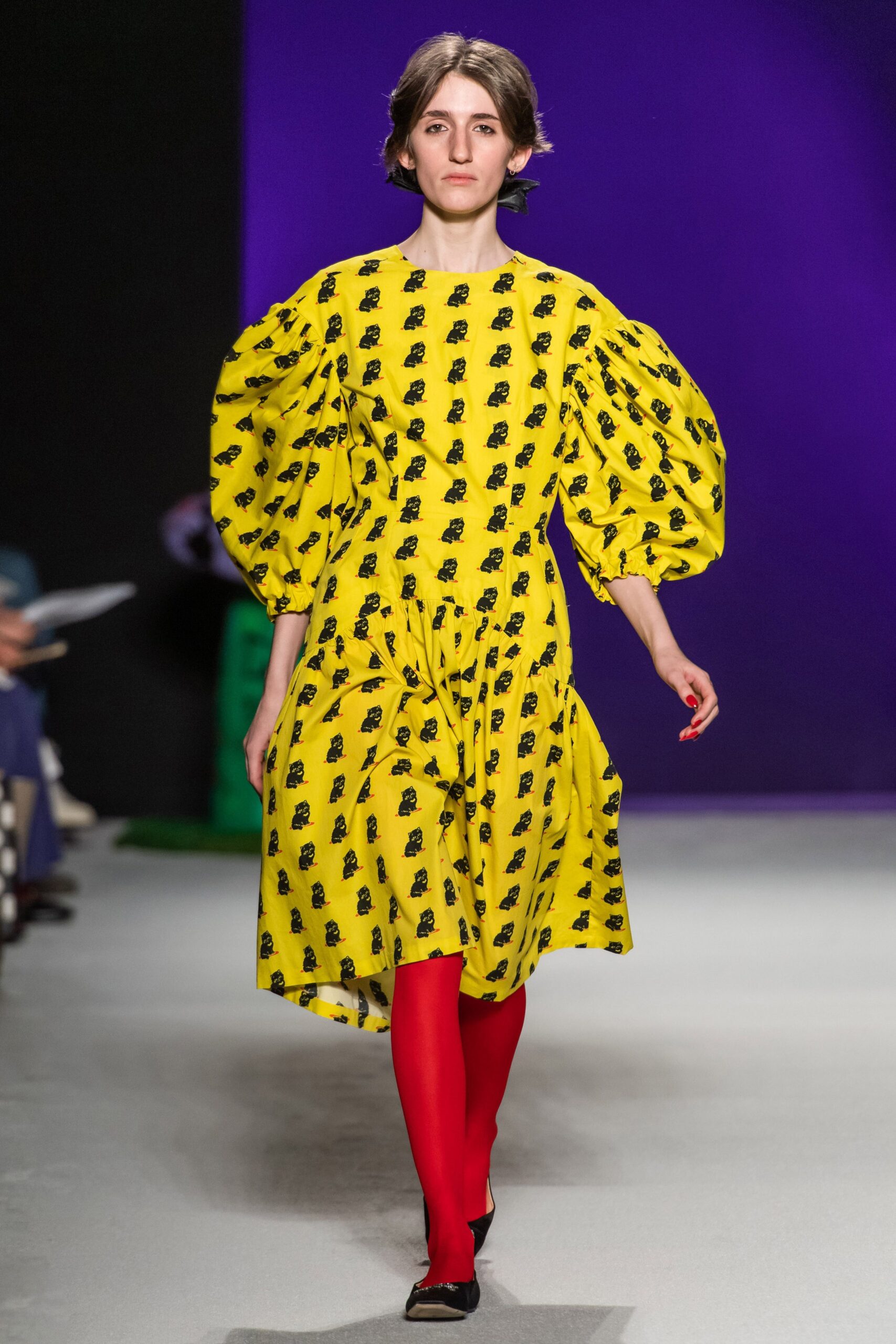 yellow printed midi dress with red tights