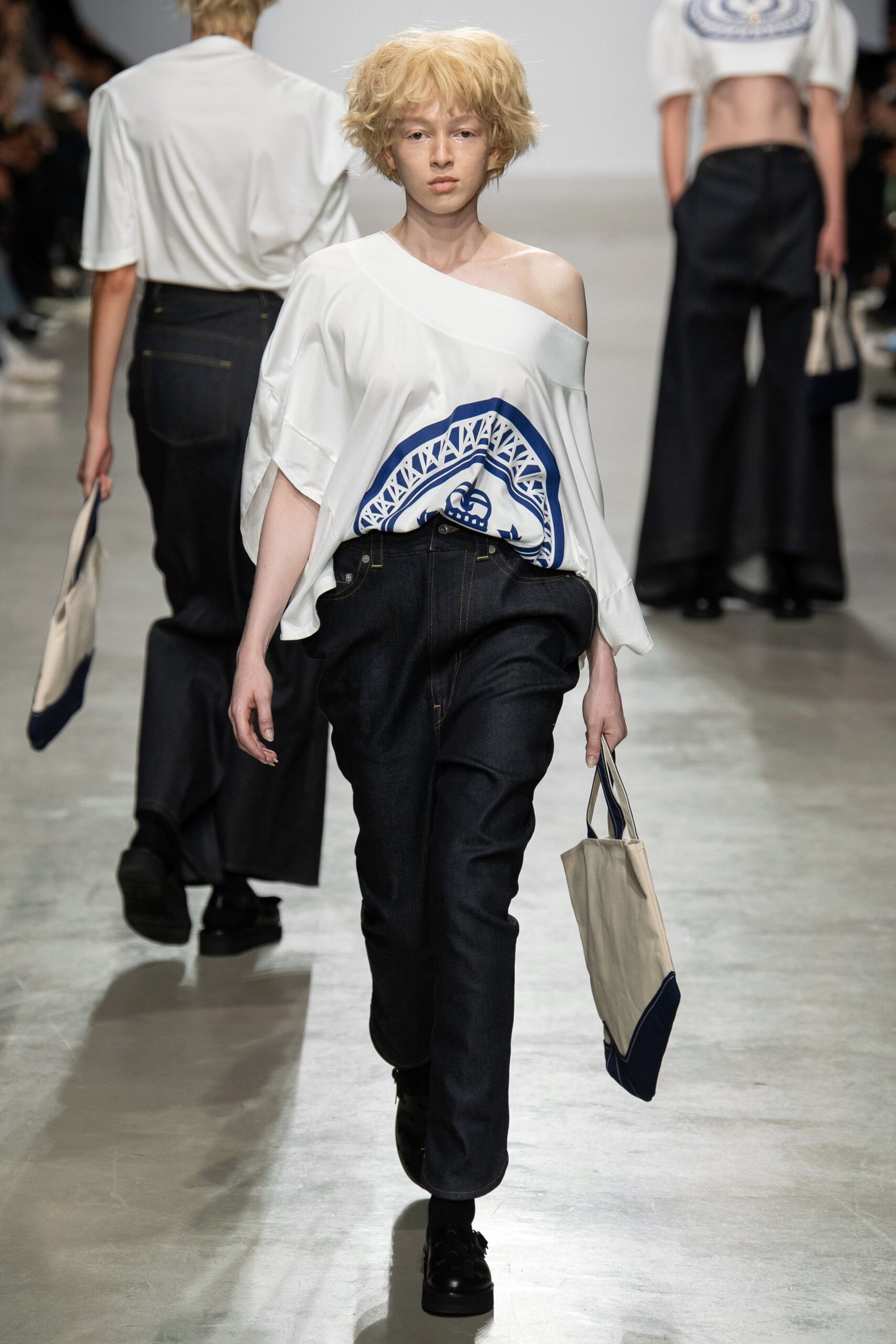 white off-shoulder top and blue wide-leg pants