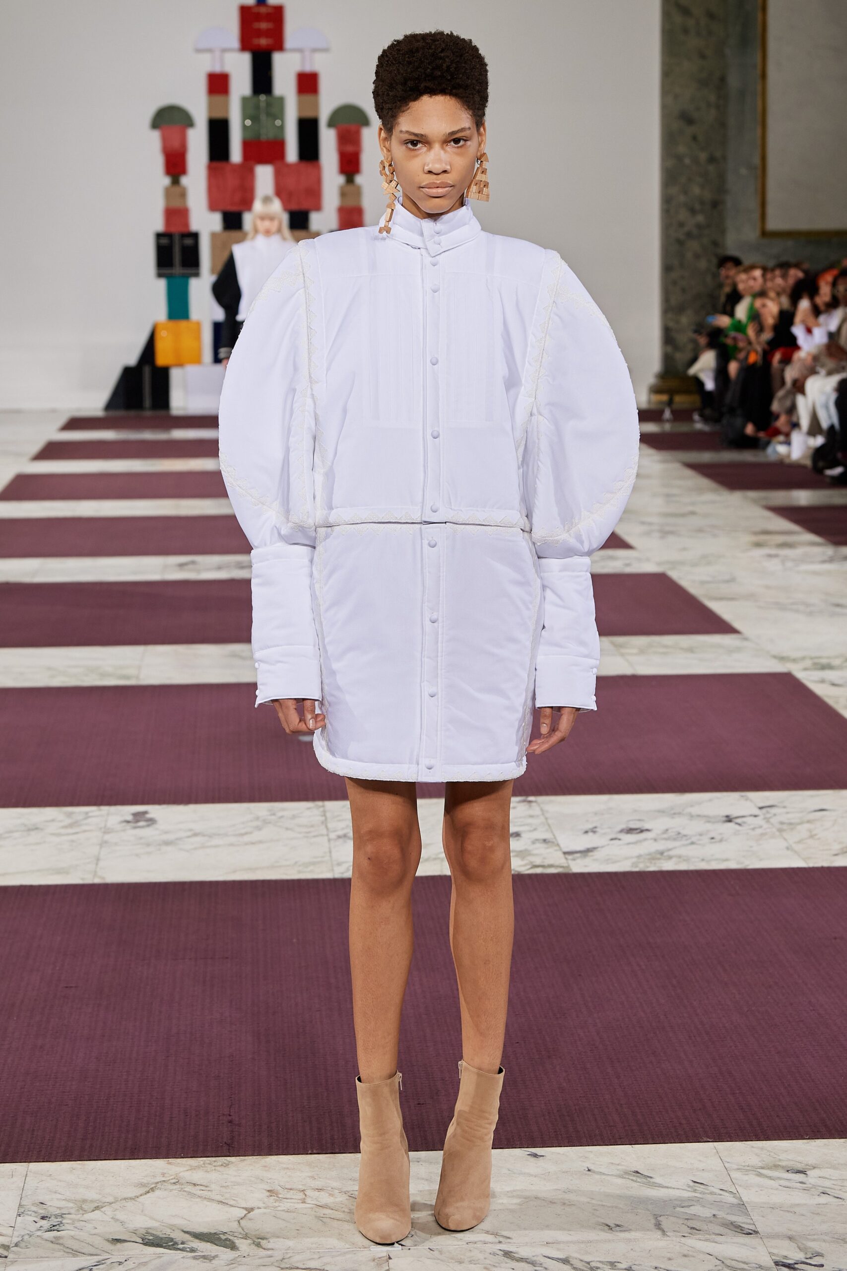 white cotton long-sleeve collared relaxed padded buttoned coat