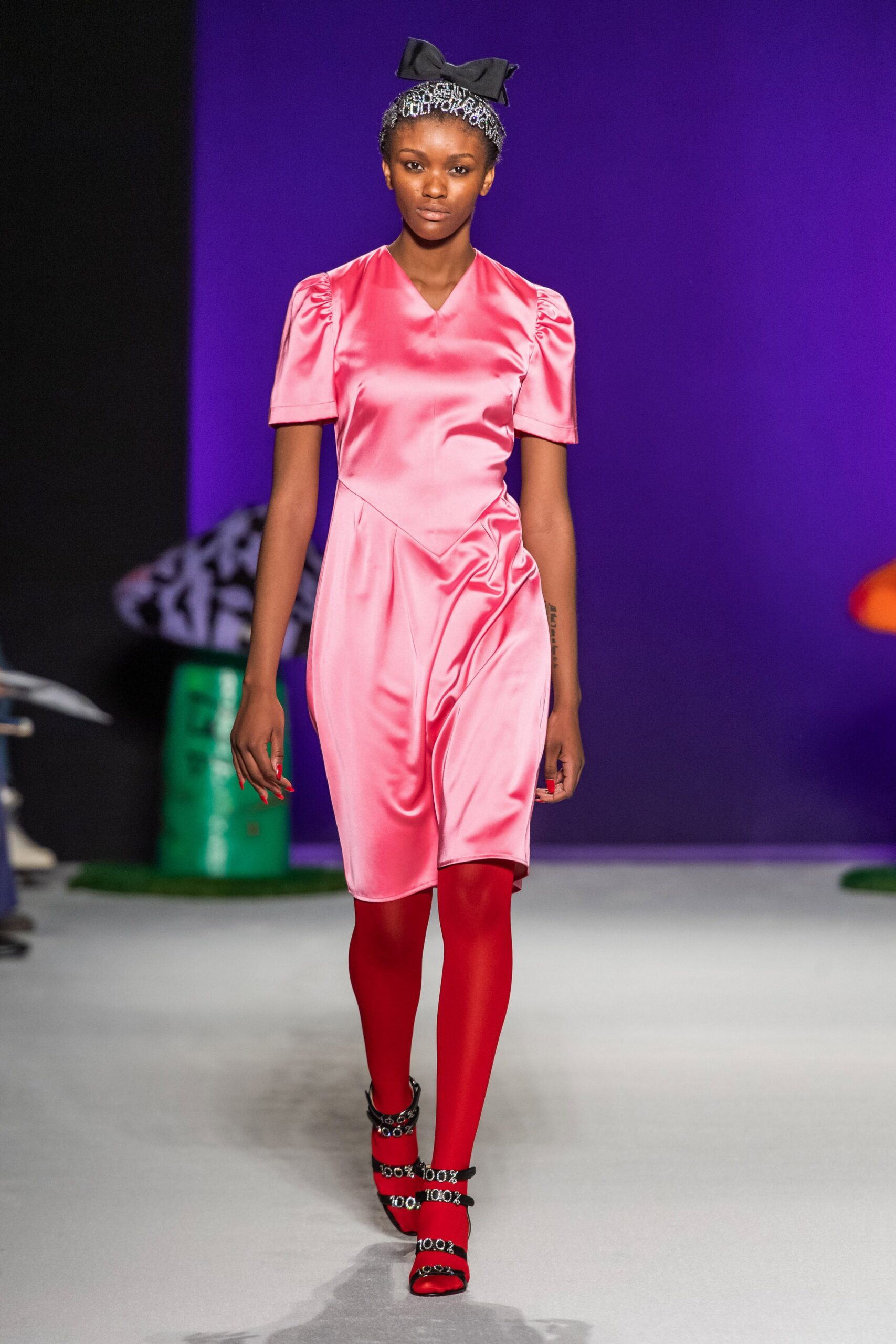 pink silk mini dress with red leggings