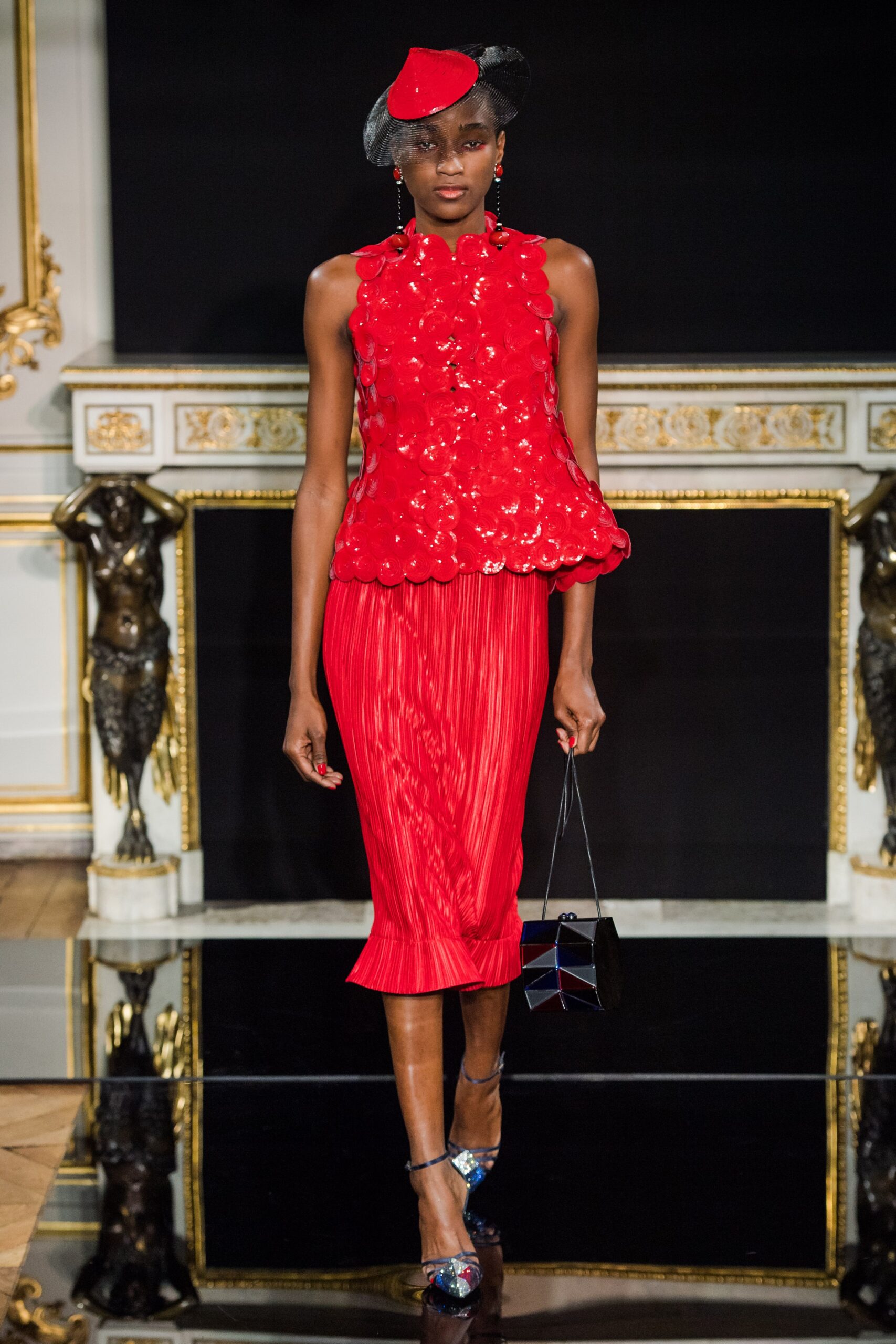 red silk sleeveless high-neck fitted pleated sequined top
