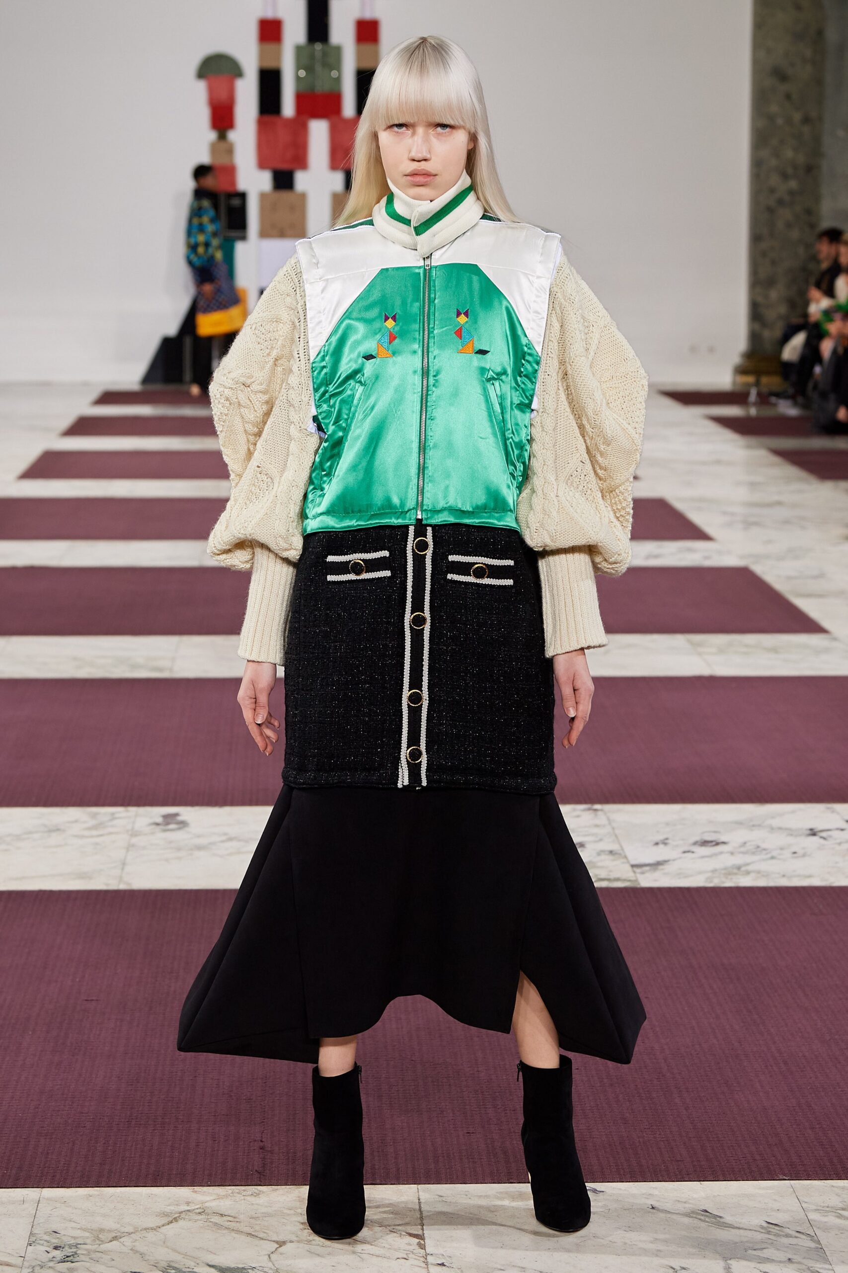 green and white relaxed jacket with black midi skirt