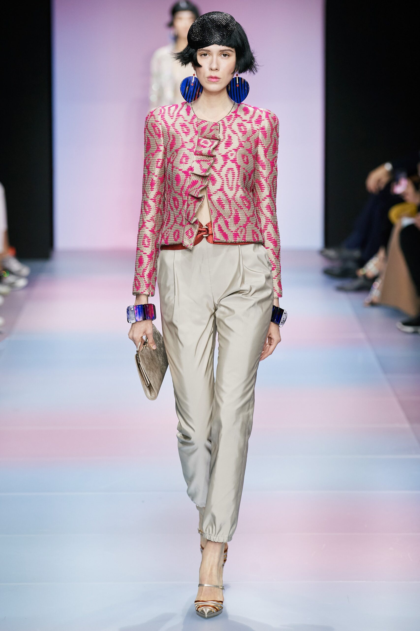 pink embroidered jacket with beige pants