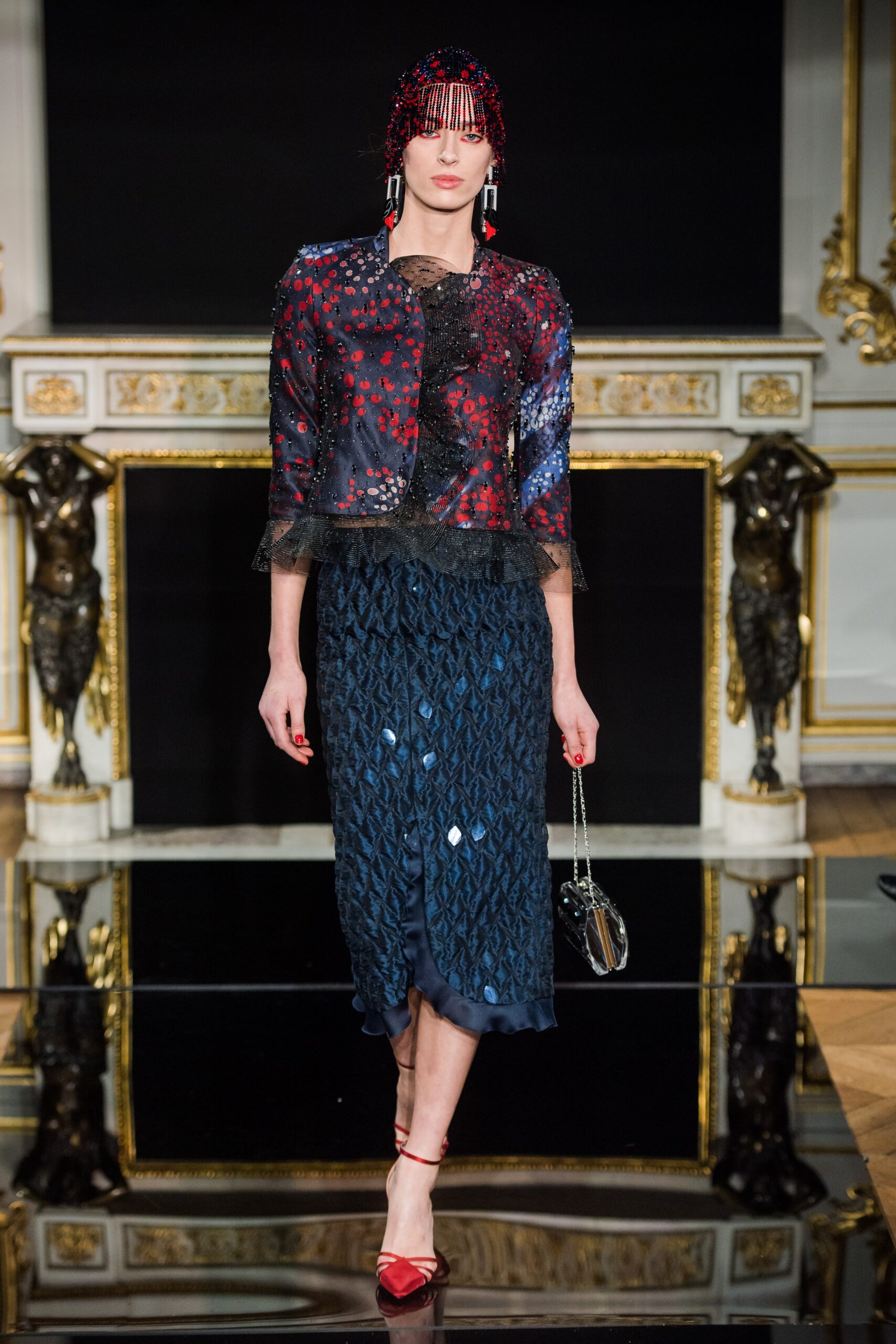 embroidered silk jacket and pleated skirt