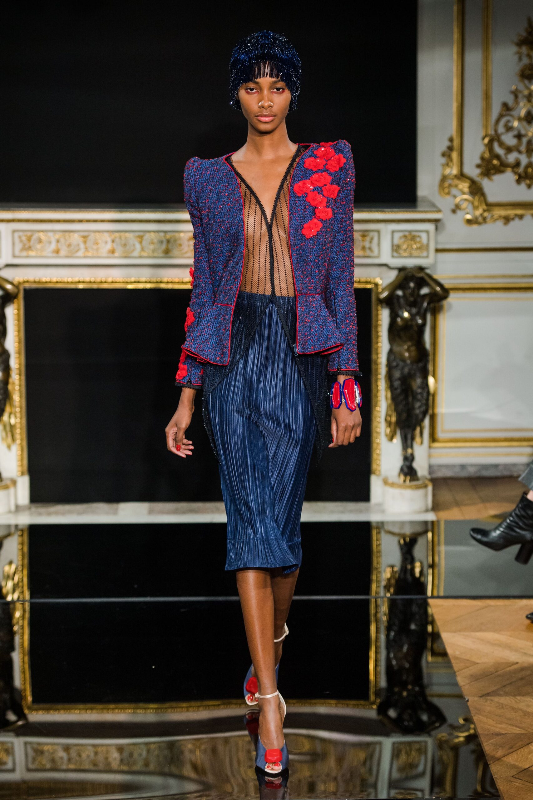 blue embroidered jacket with pleated skirt