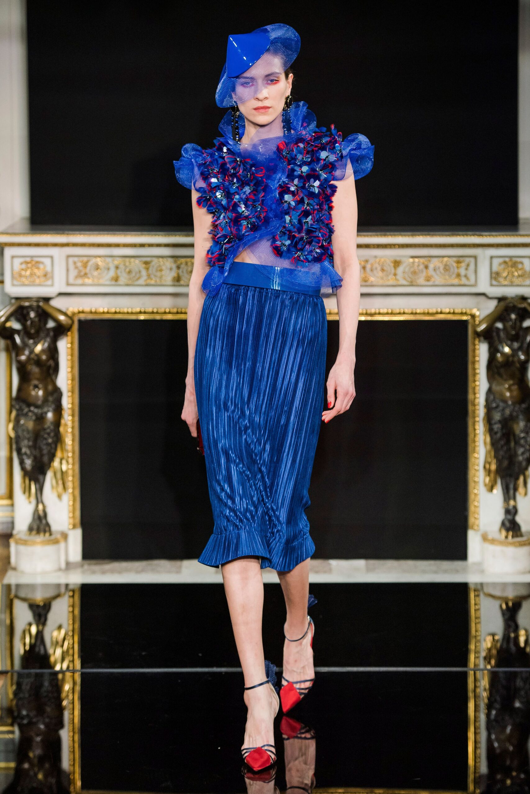blue silk ruffled top and pleated skirt