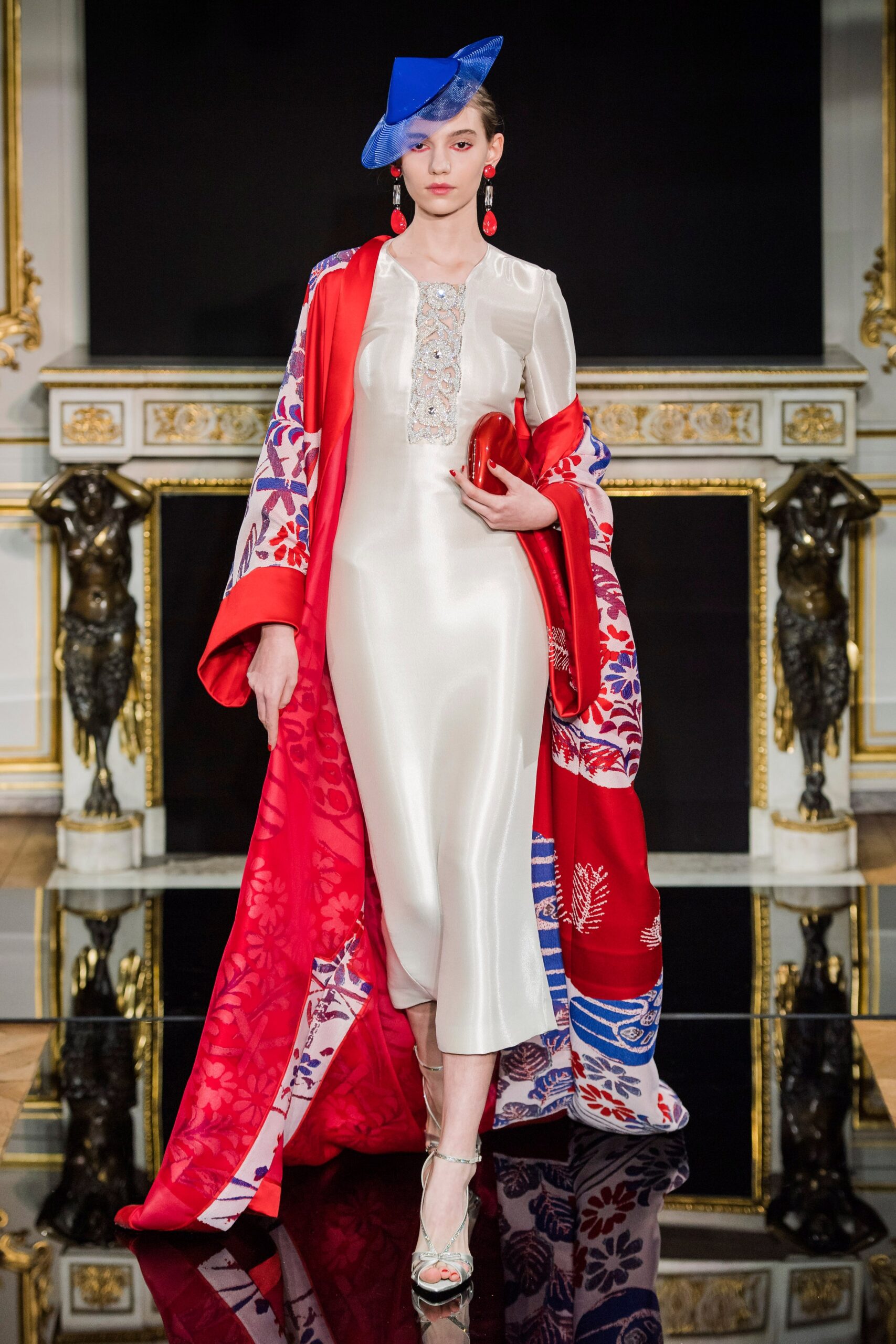 white silk fitted gown with cape