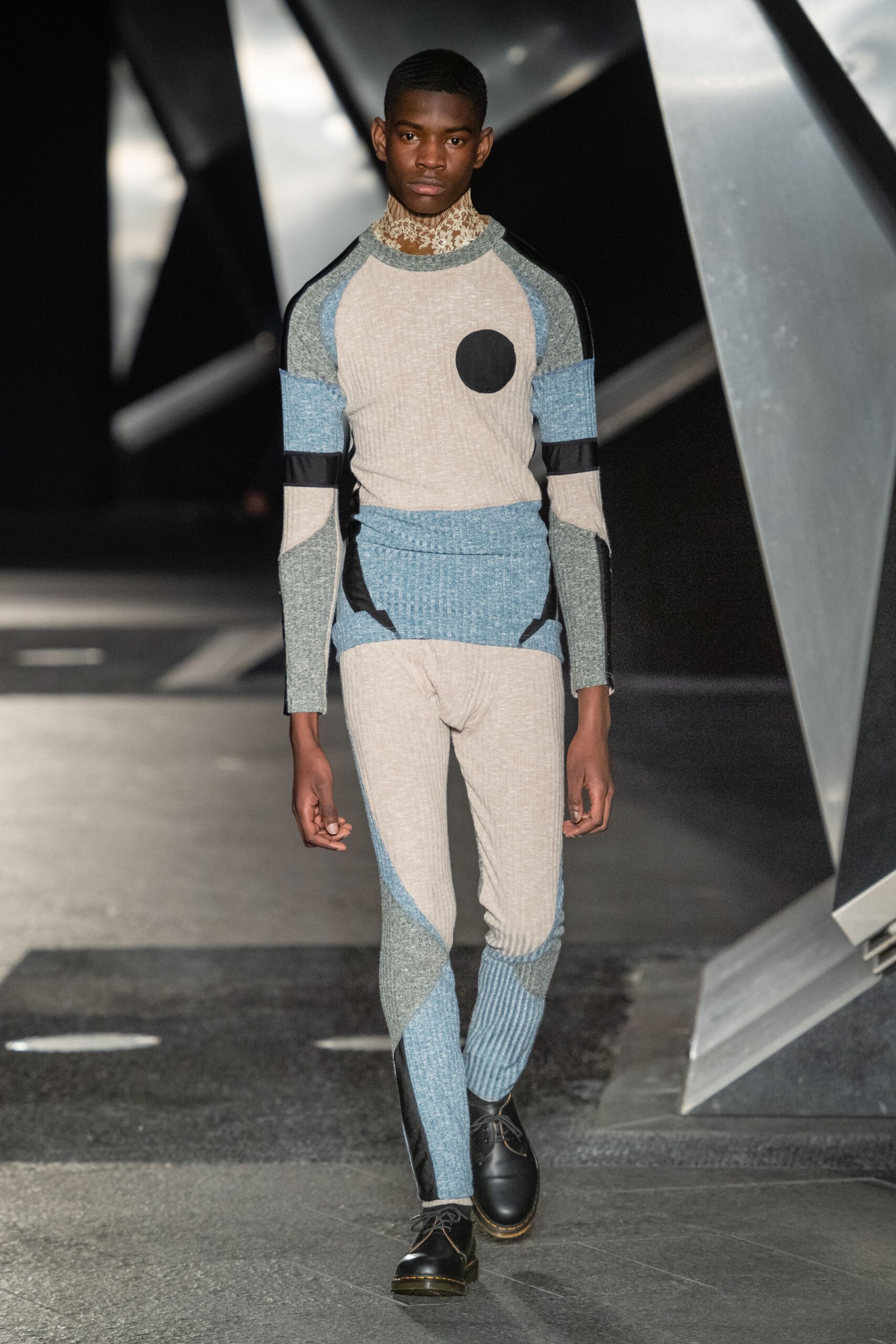 beige and blue color-blocked catsuit