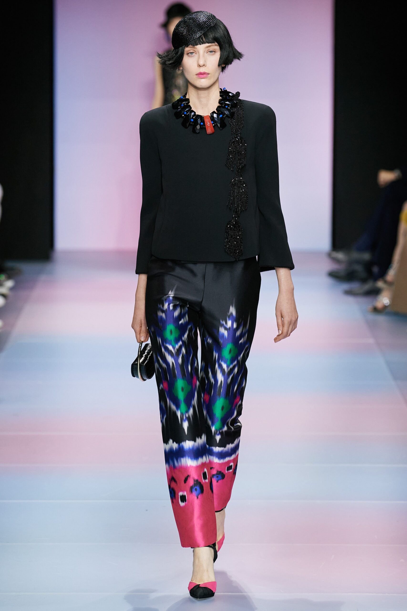 black fitted top with multi printed pants