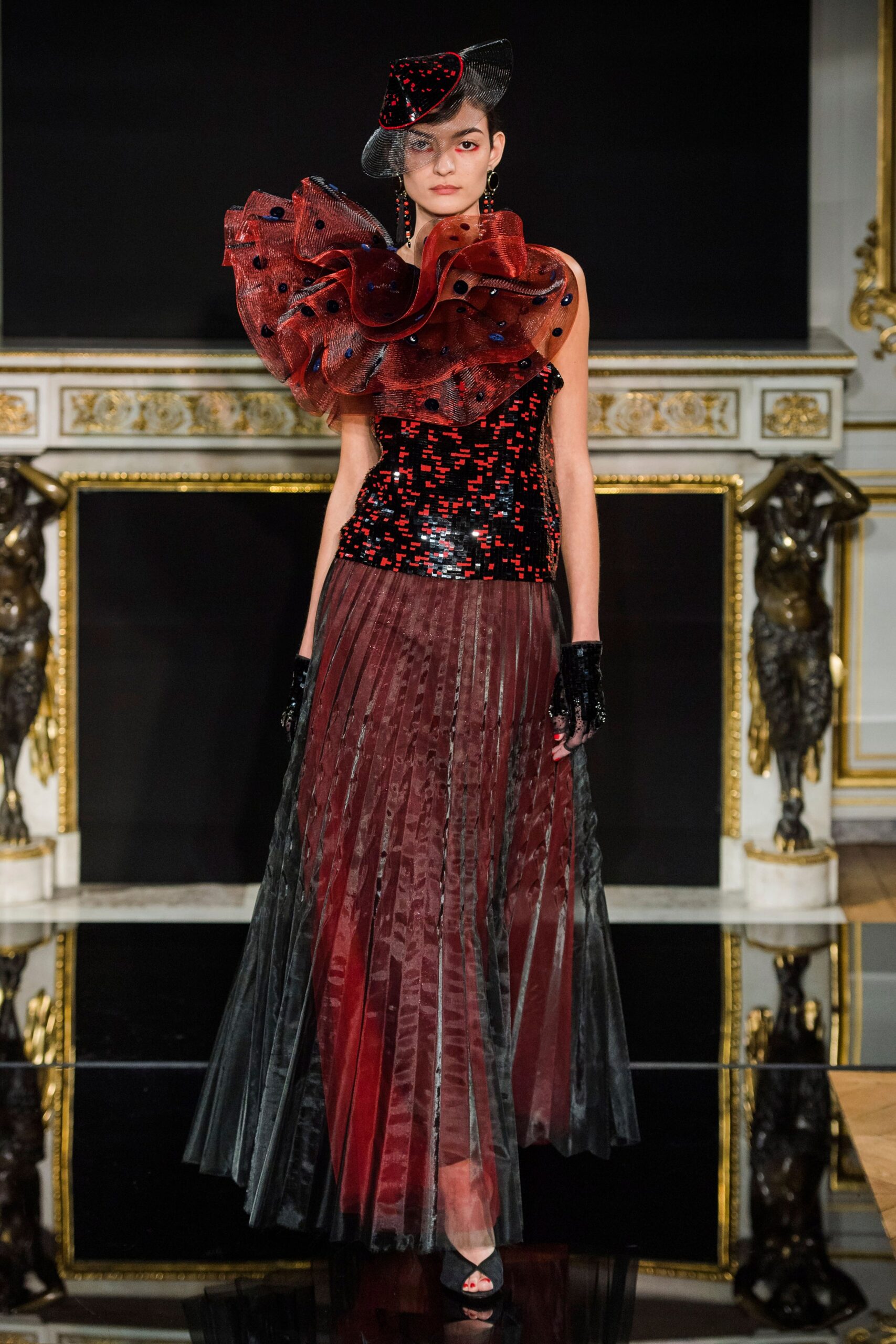black and red ruffled top with pleated skirt