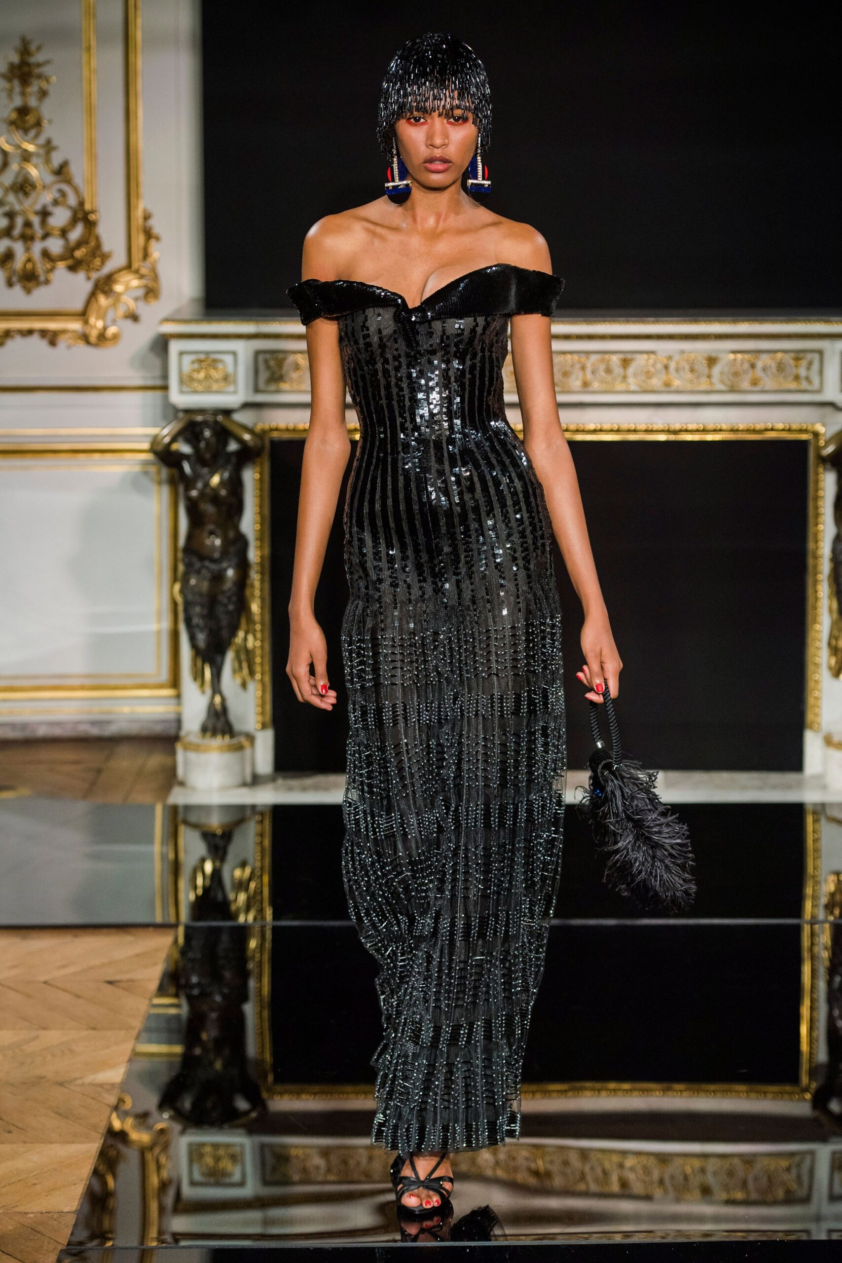 black sequin off-shoulder gown