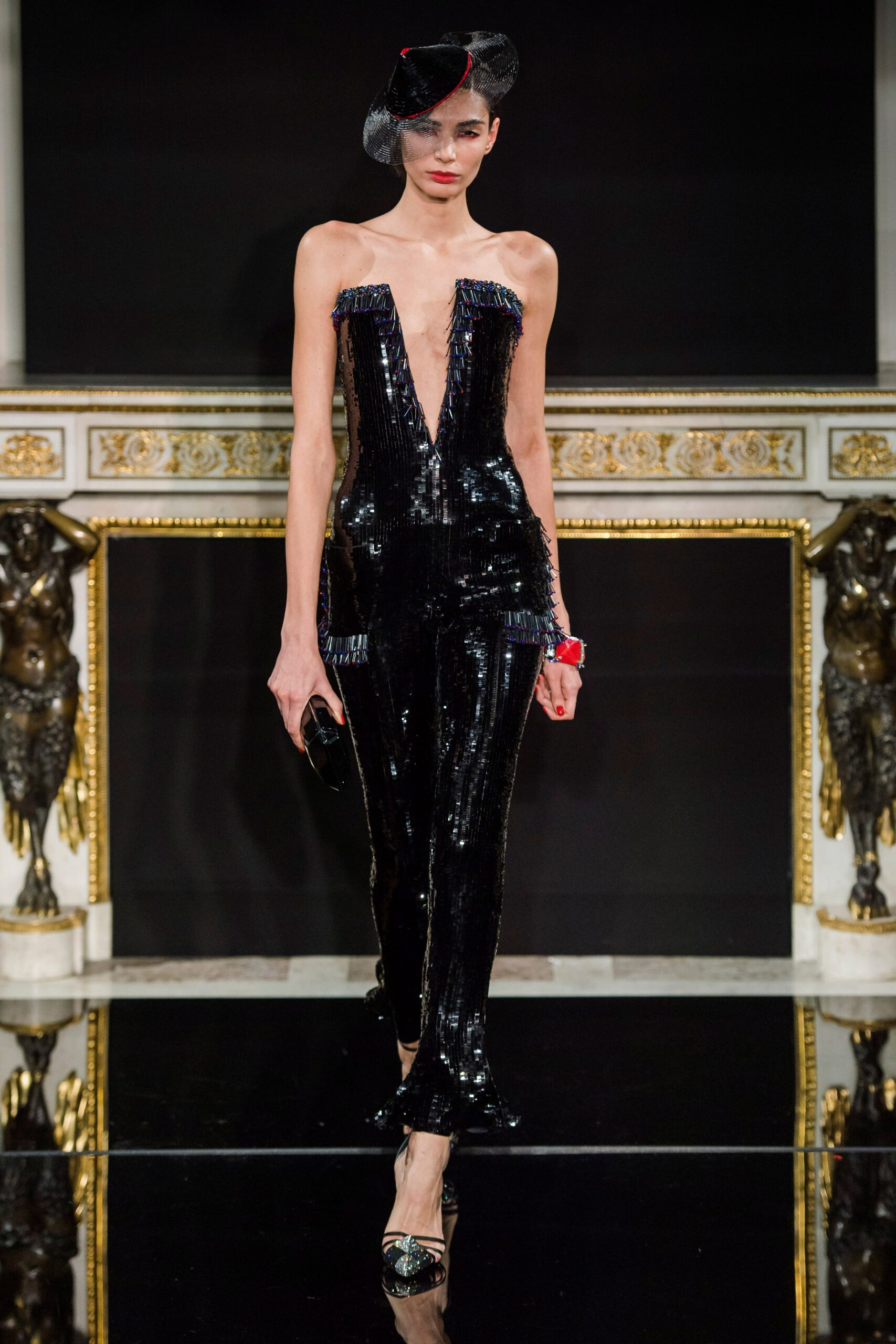 black sequin sleeveless catsuit