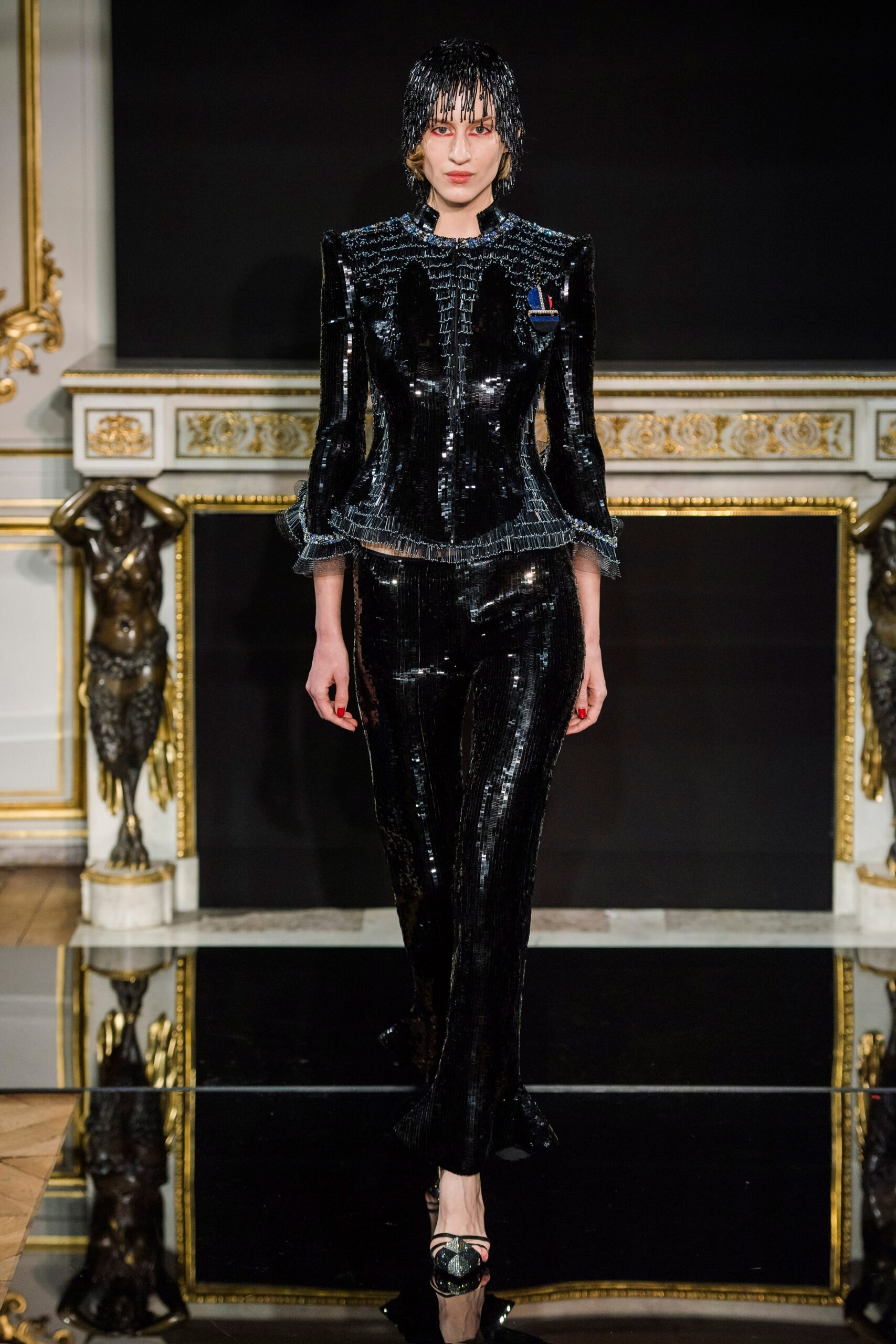 fitted black vinyl suit