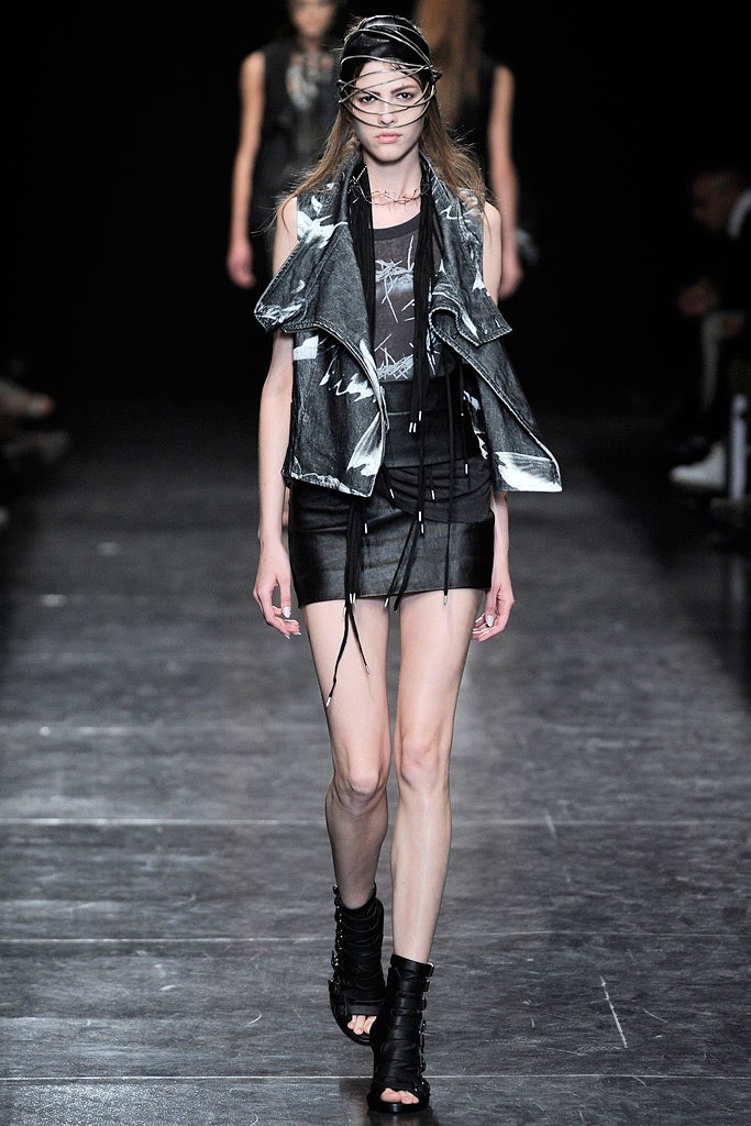 black leather fitted vest and mini skirt