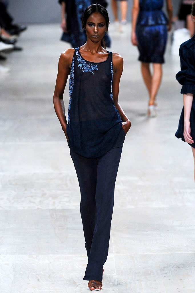 blue sheer embroidered top with black pants