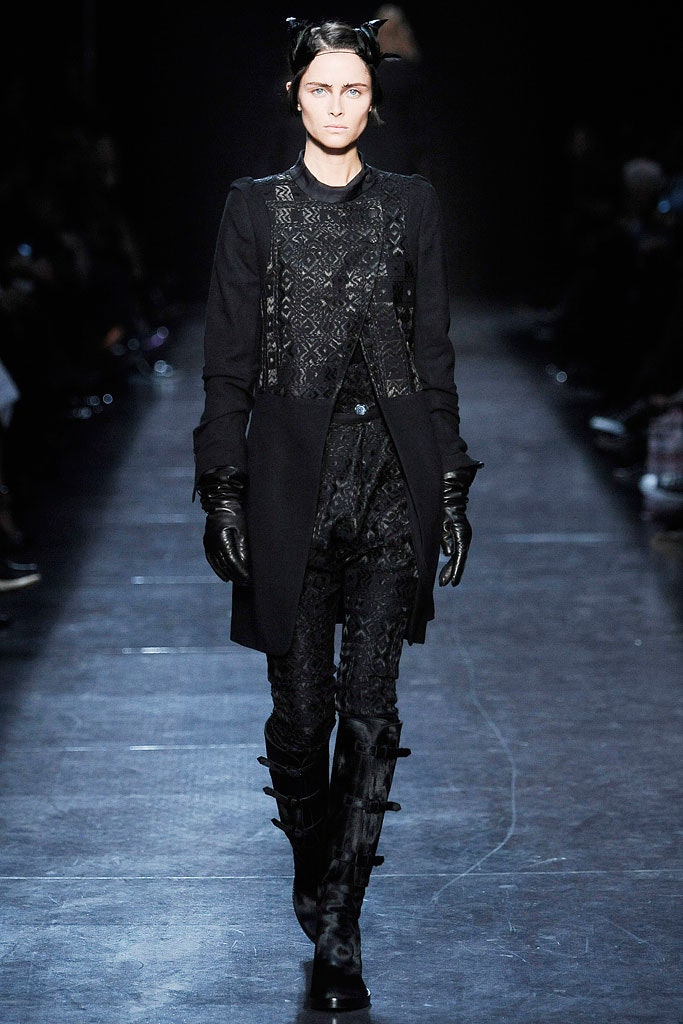 black fitted coat with textured pants