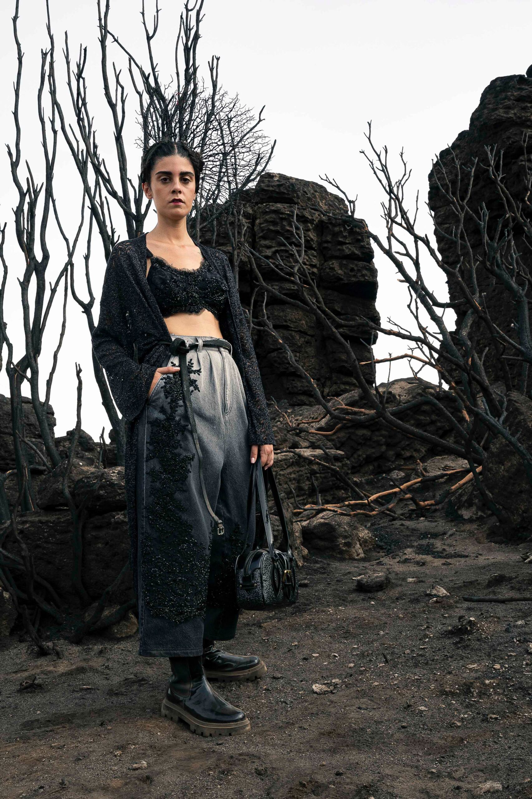 black silk fitted top with gray pants