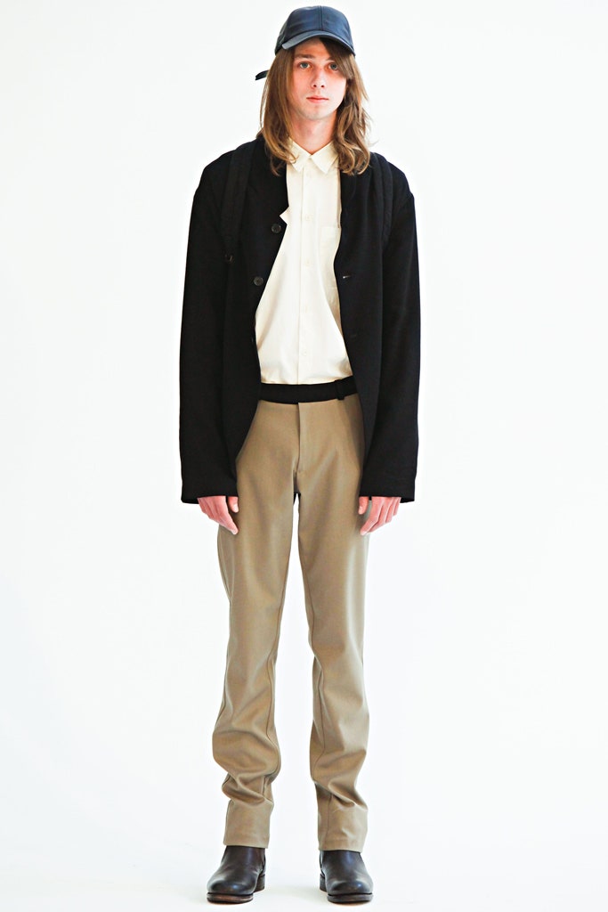 black oversized jacket with beige pants