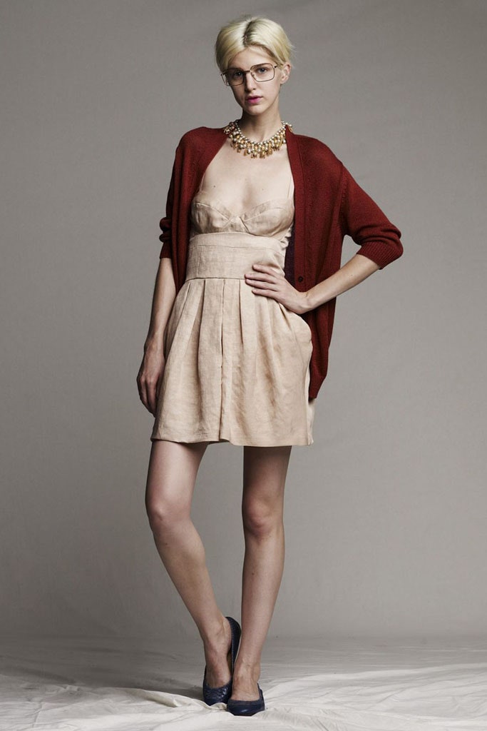beige pleated mini dress with red cardigan