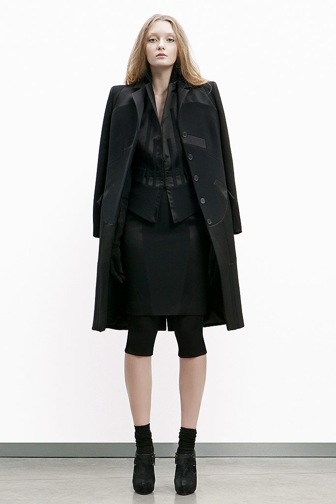 black structured coat and fitted blazer