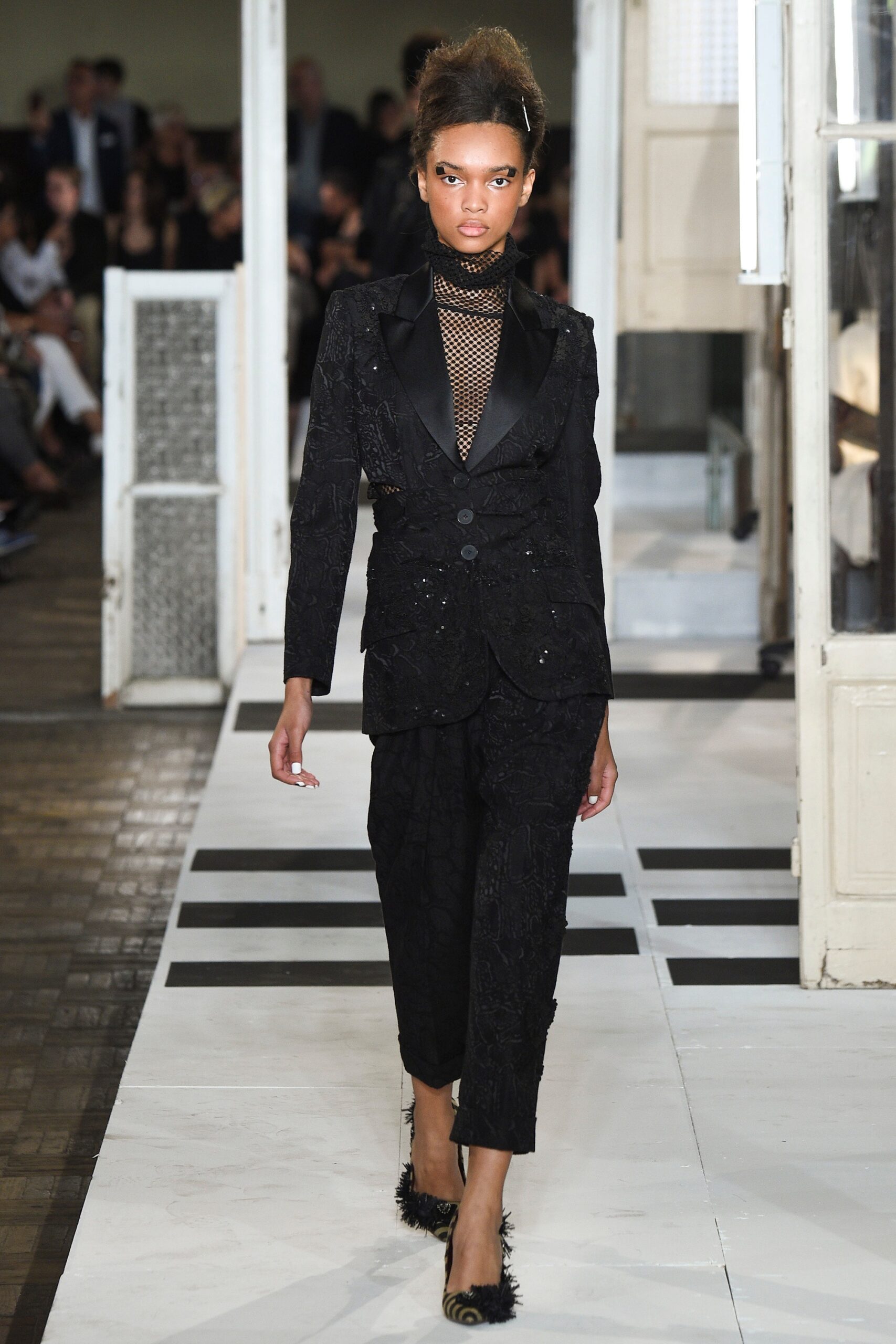 black tailored suit with embellished shoes