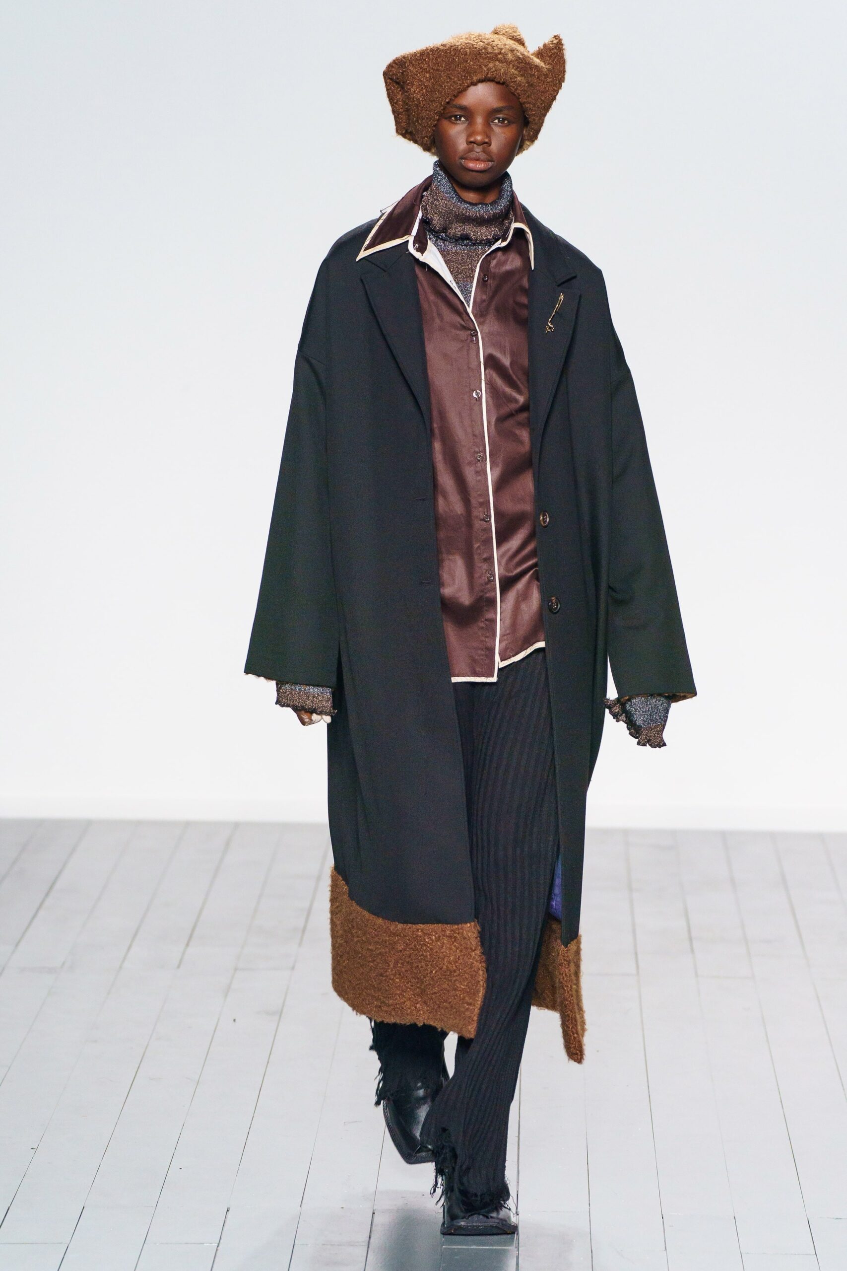 black wool long-sleeve collared oversized buttoned layered coat