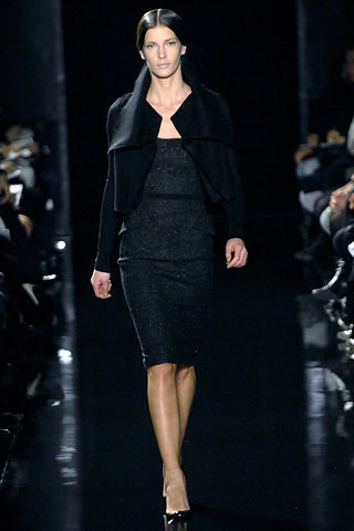 black fitted midi dress with structured jacket