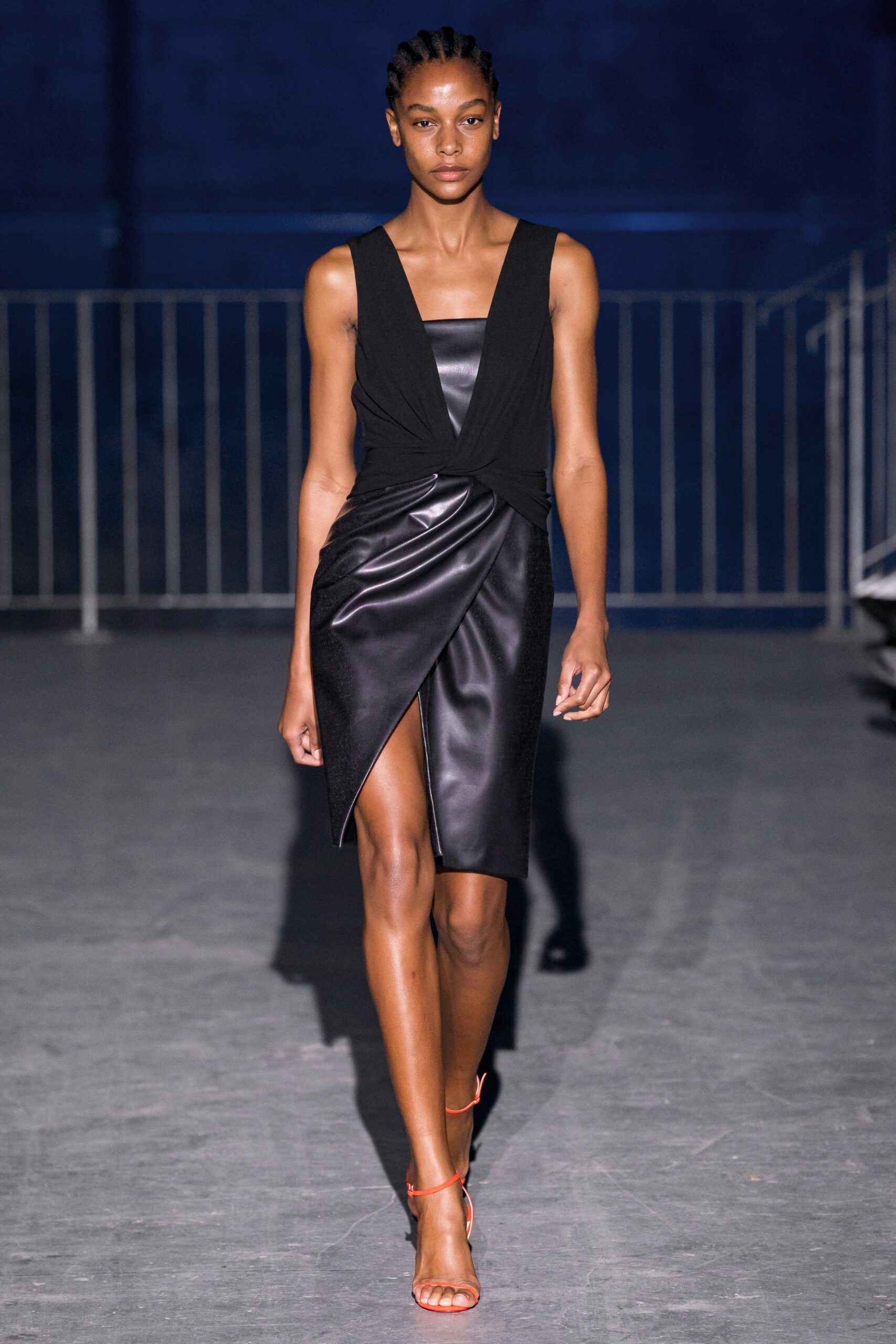 black leather fitted dress with strappy shoes