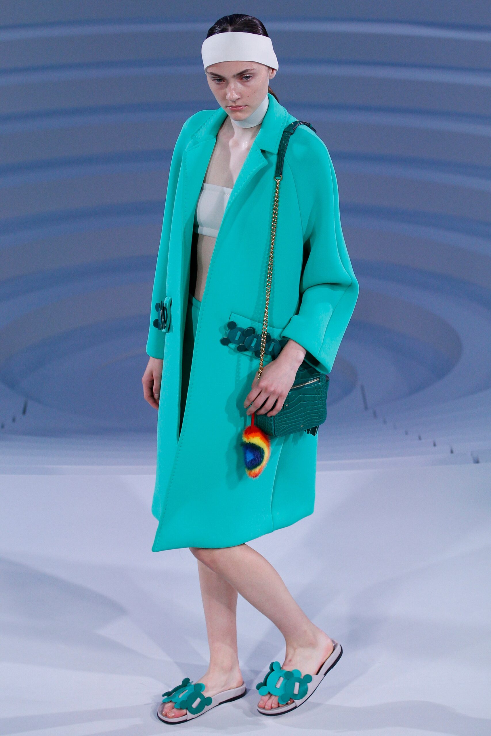 teal coat with white top