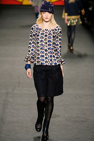 multi-colored printed blouse with black skirt