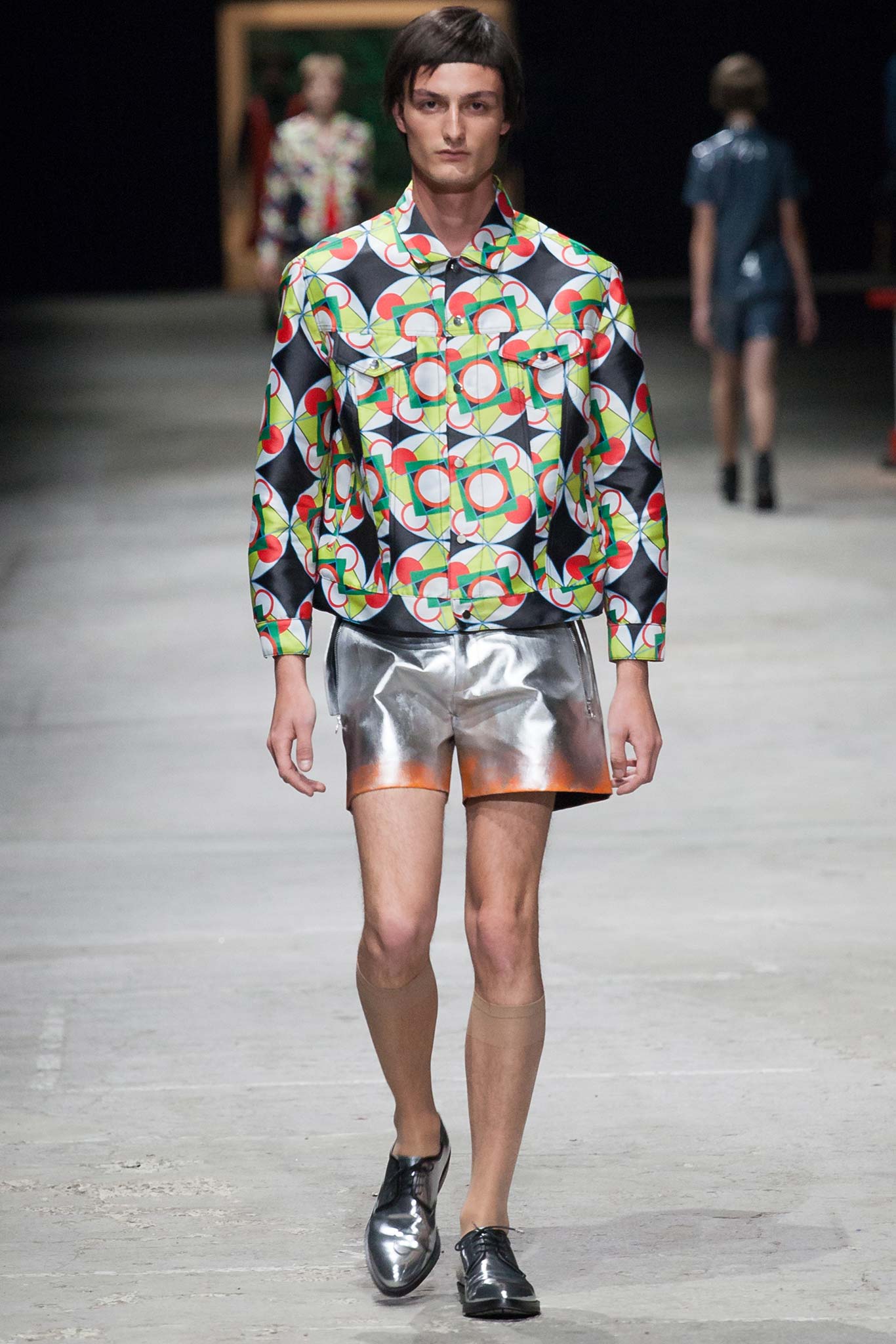 multi-colored printed shirt and silver shorts