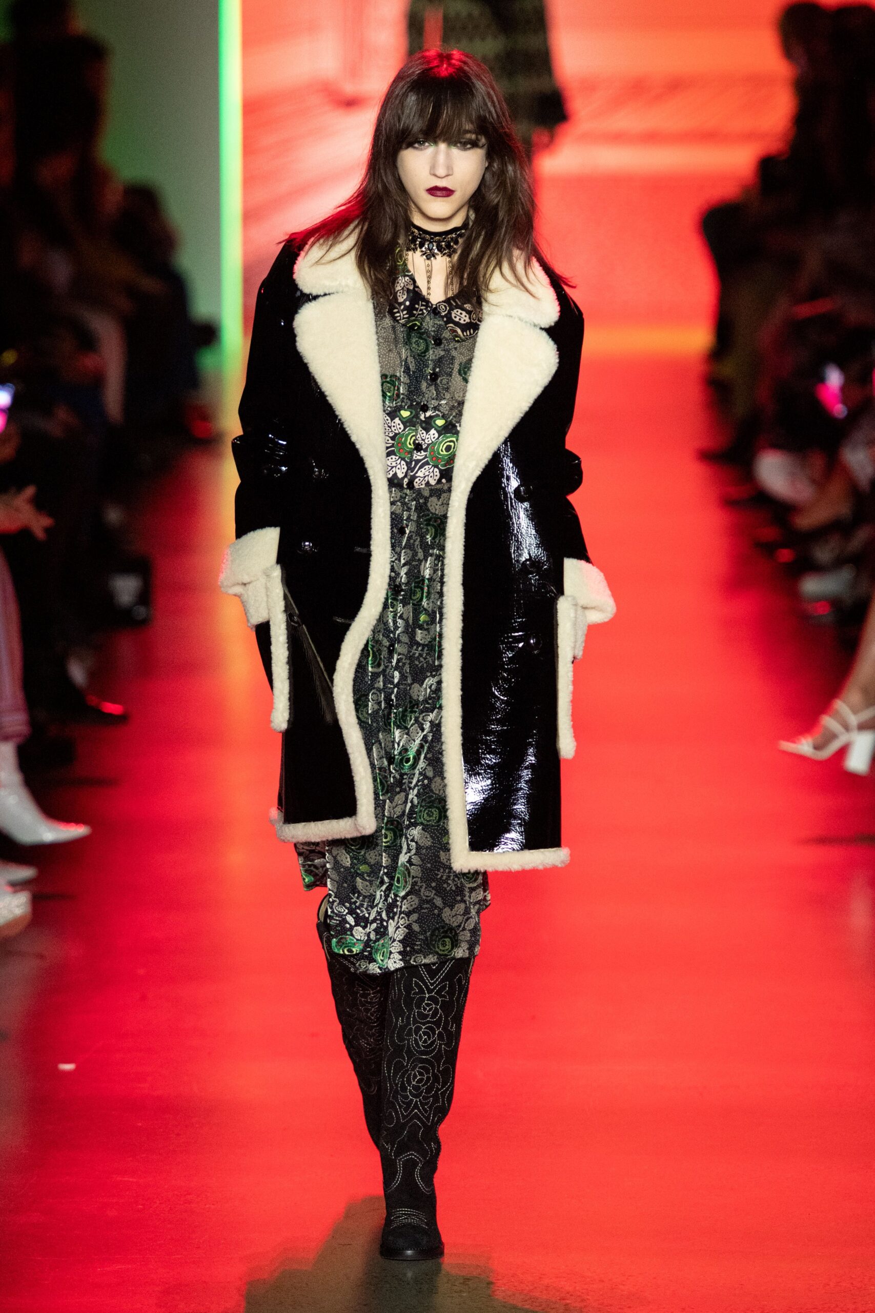 black leather coat and green dress