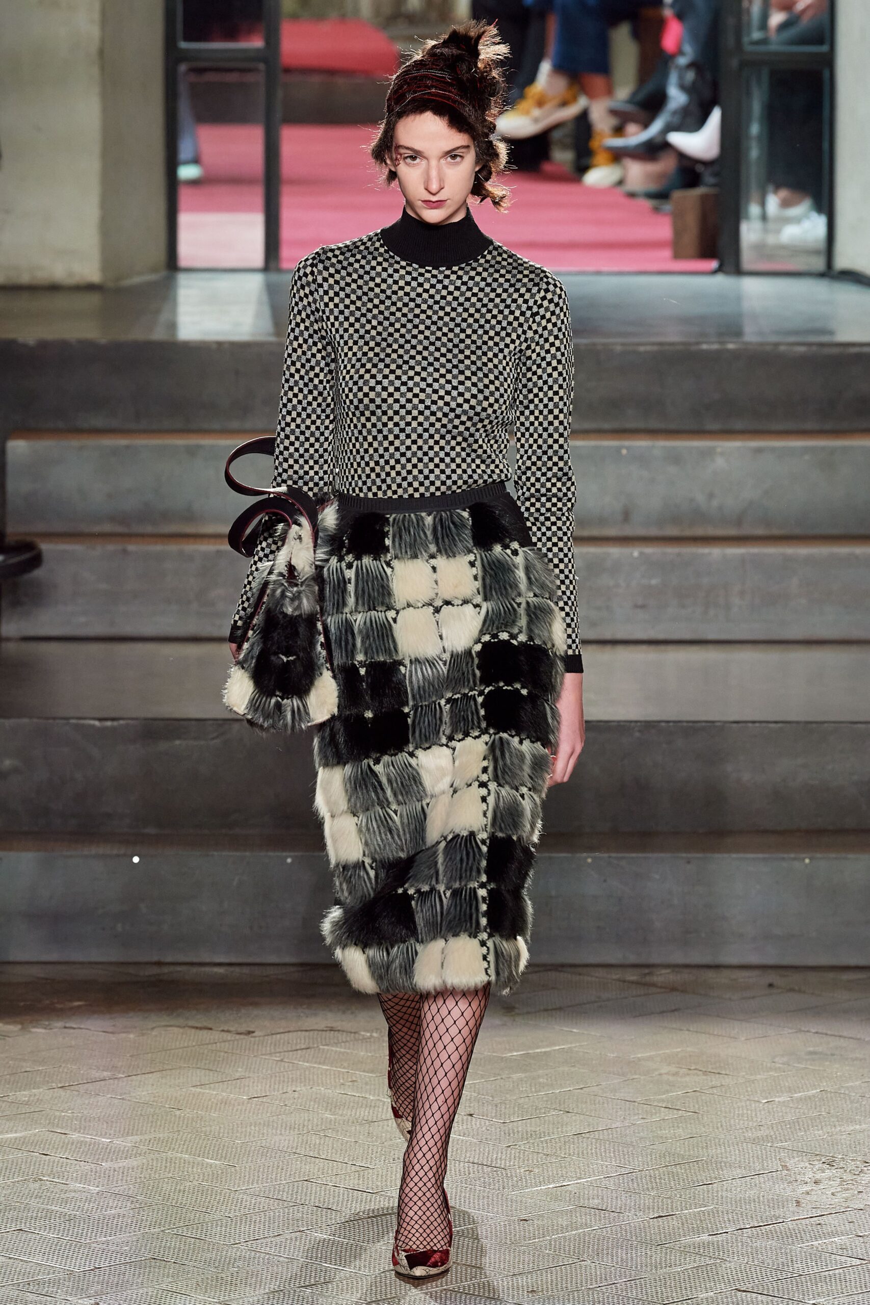 black and white checked top with fur skirt