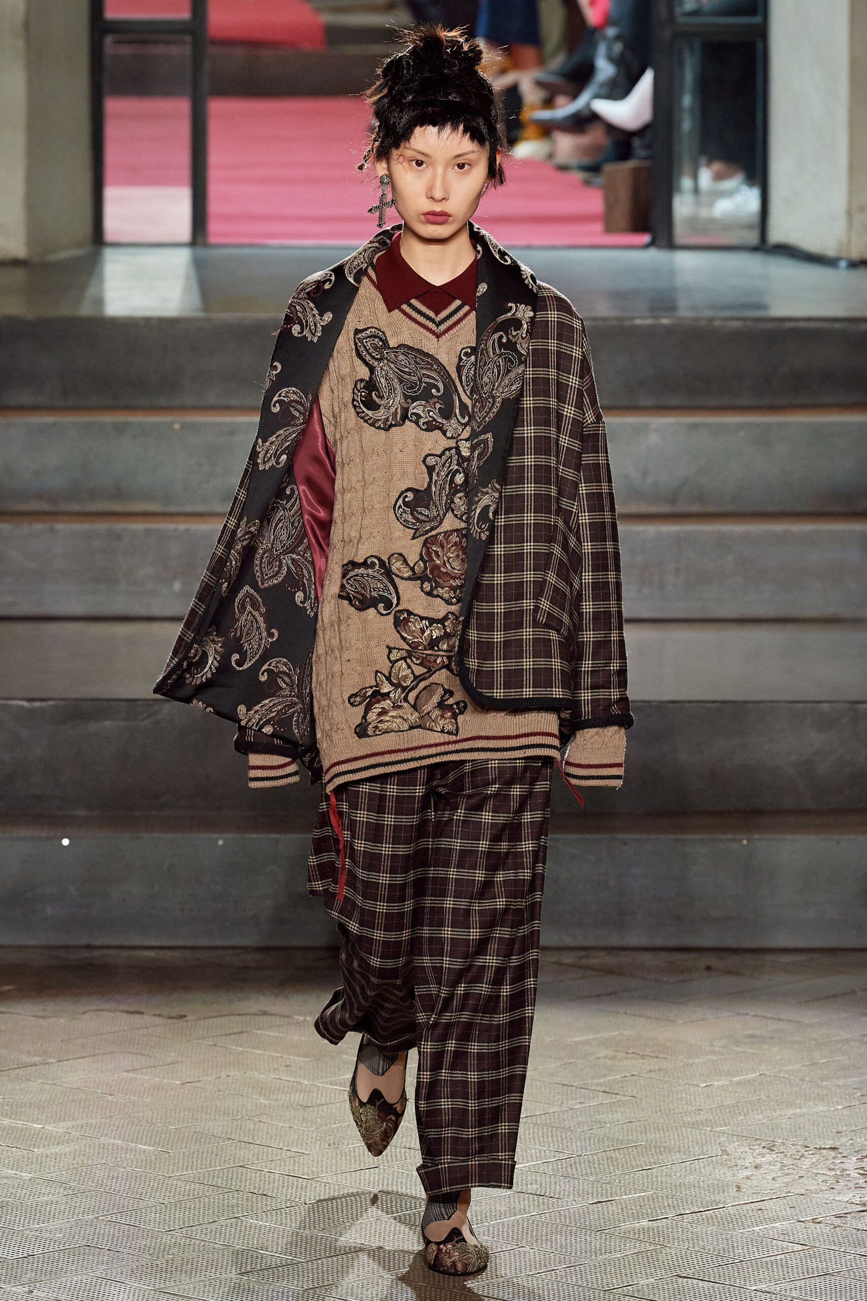 layered black and beige jacket with checked pants
